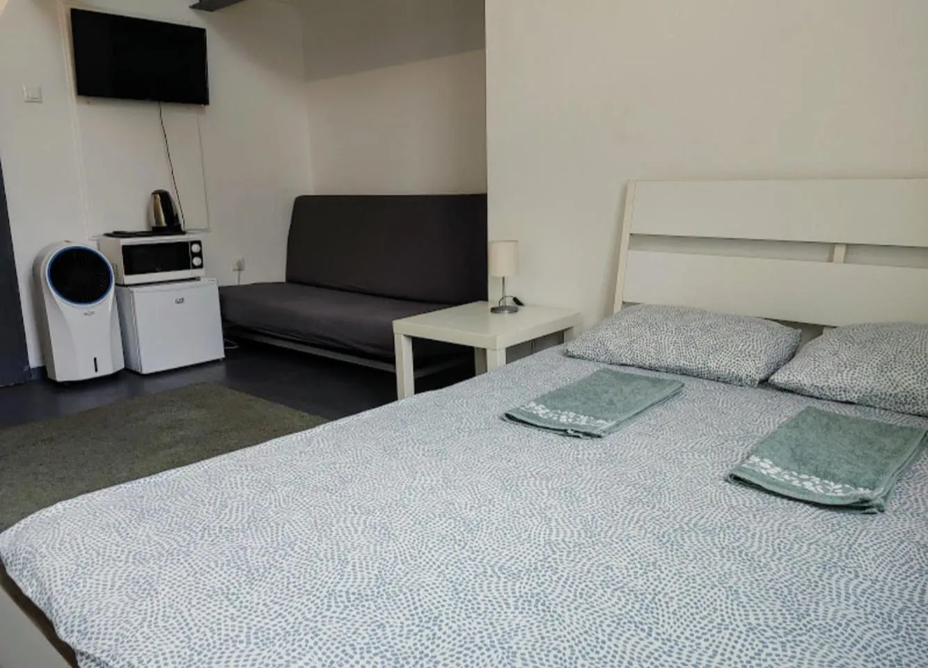 Bed in Sleepover City Center GuestRooms