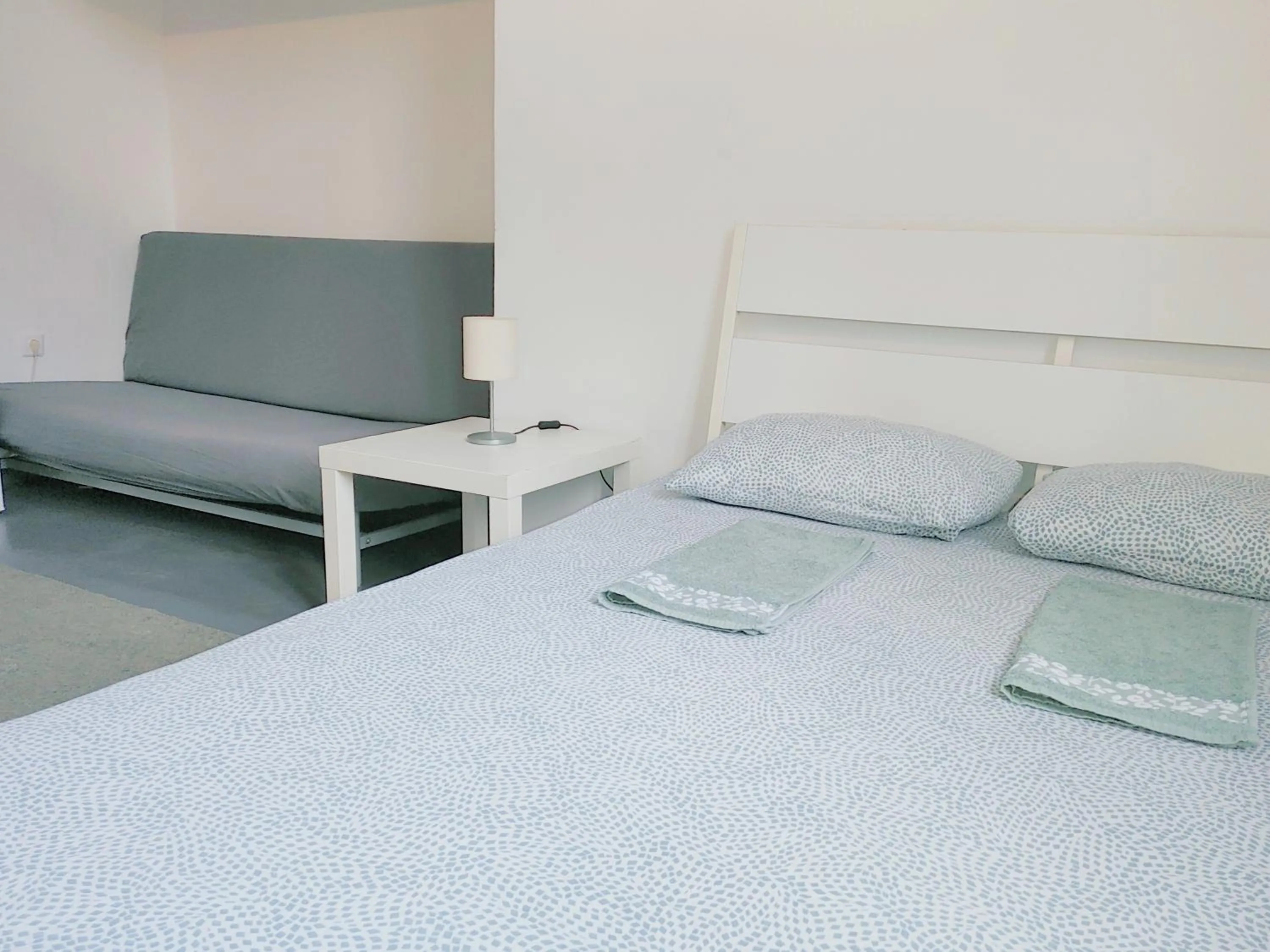 Bed in Sleepover City Center GuestRooms