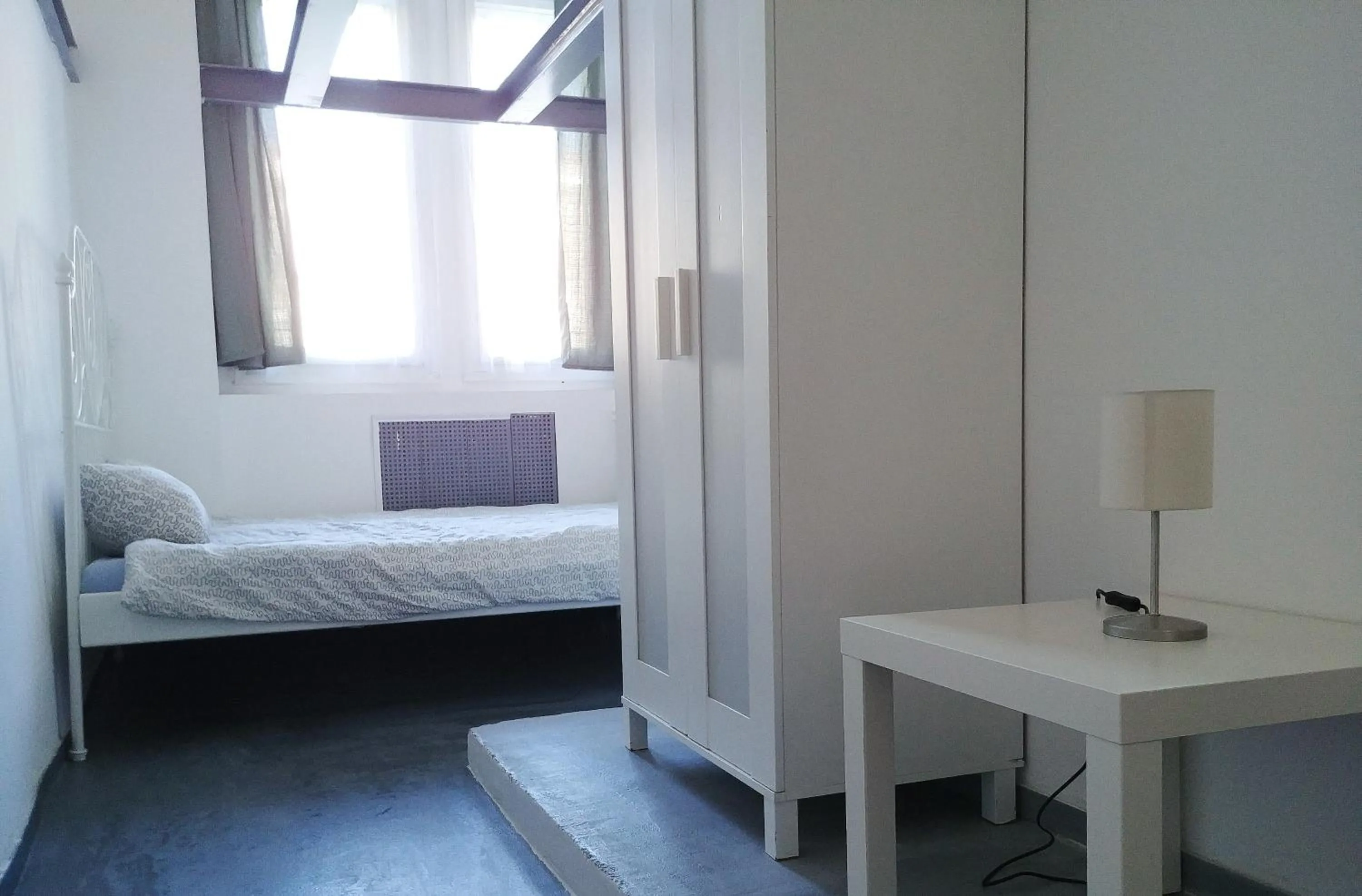 Bed in Sleepover City Center GuestRooms