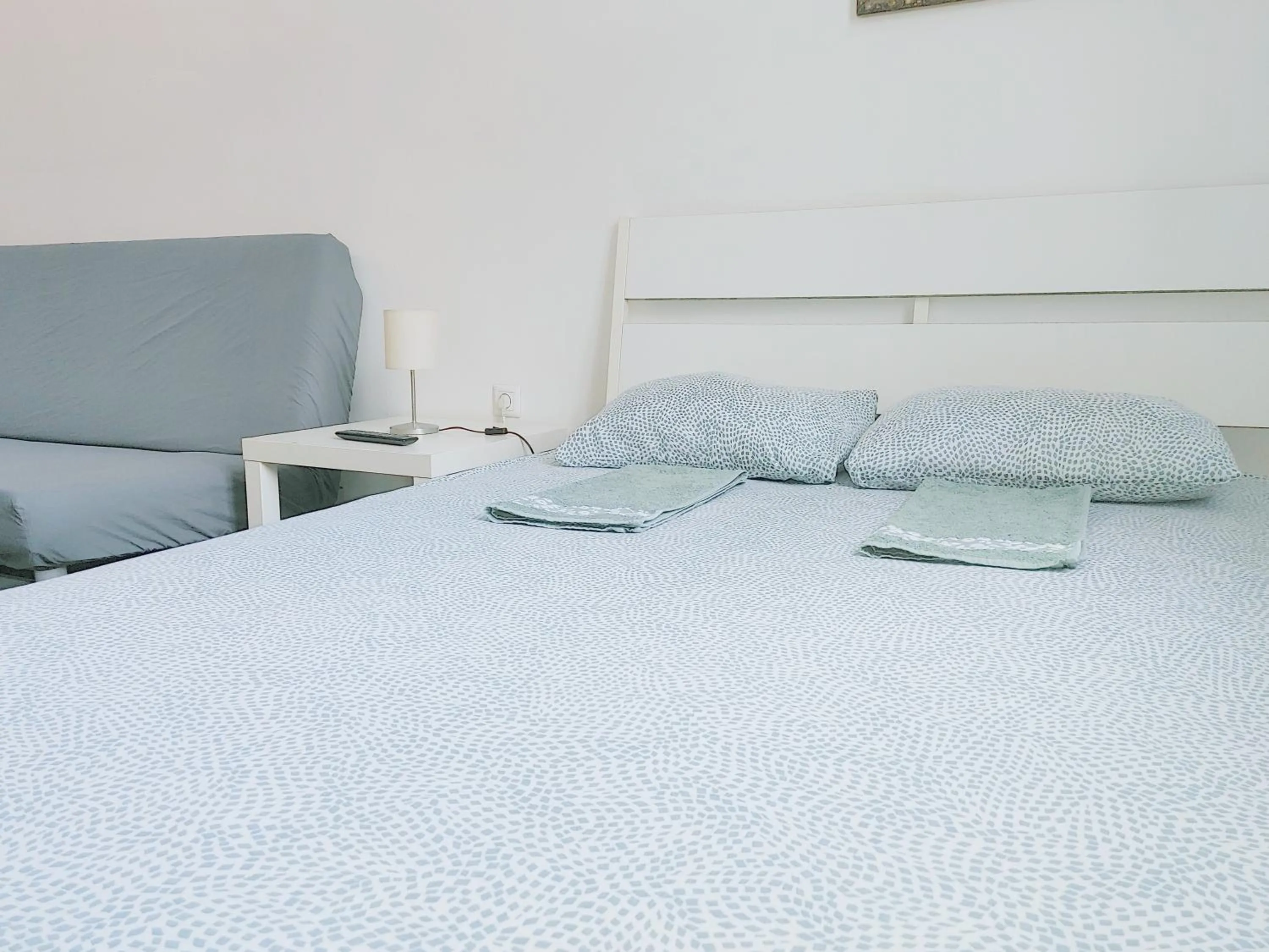 Bed in Sleepover City Center GuestRooms