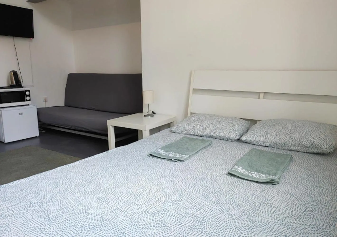 Bed in Sleepover City Center GuestRooms