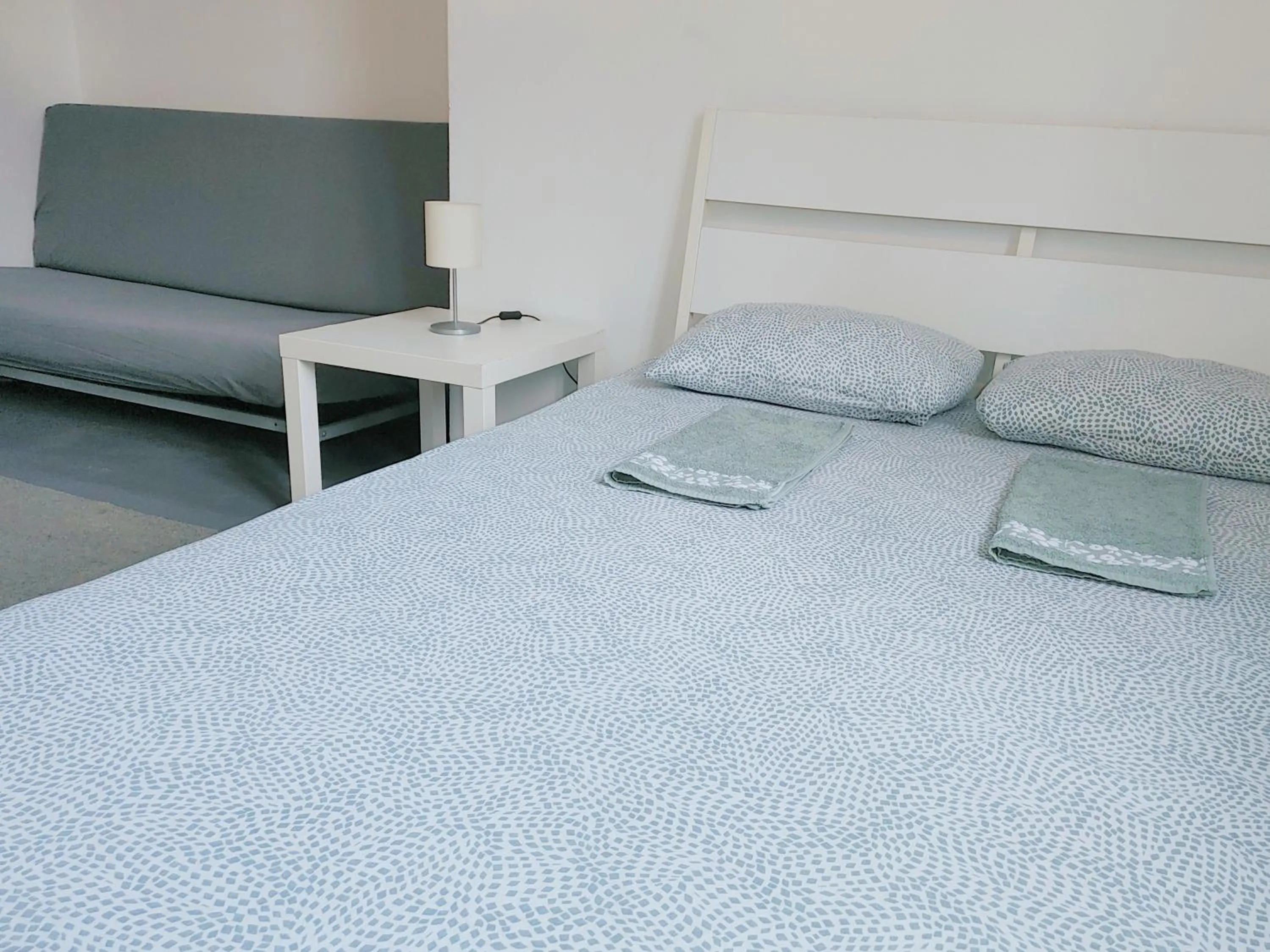 Bed in Sleepover City Center GuestRooms