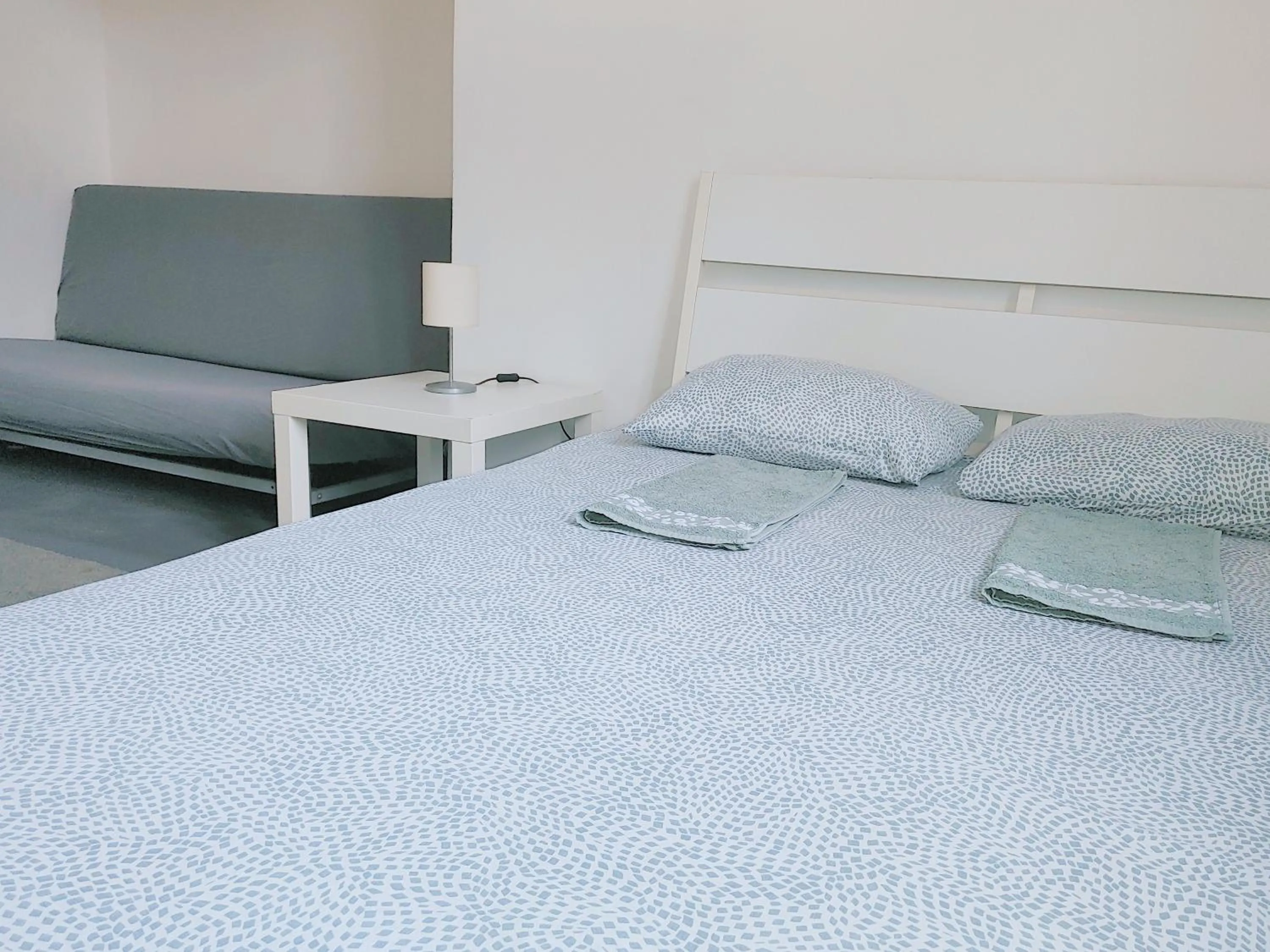 Bed in Sleepover City Center GuestRooms