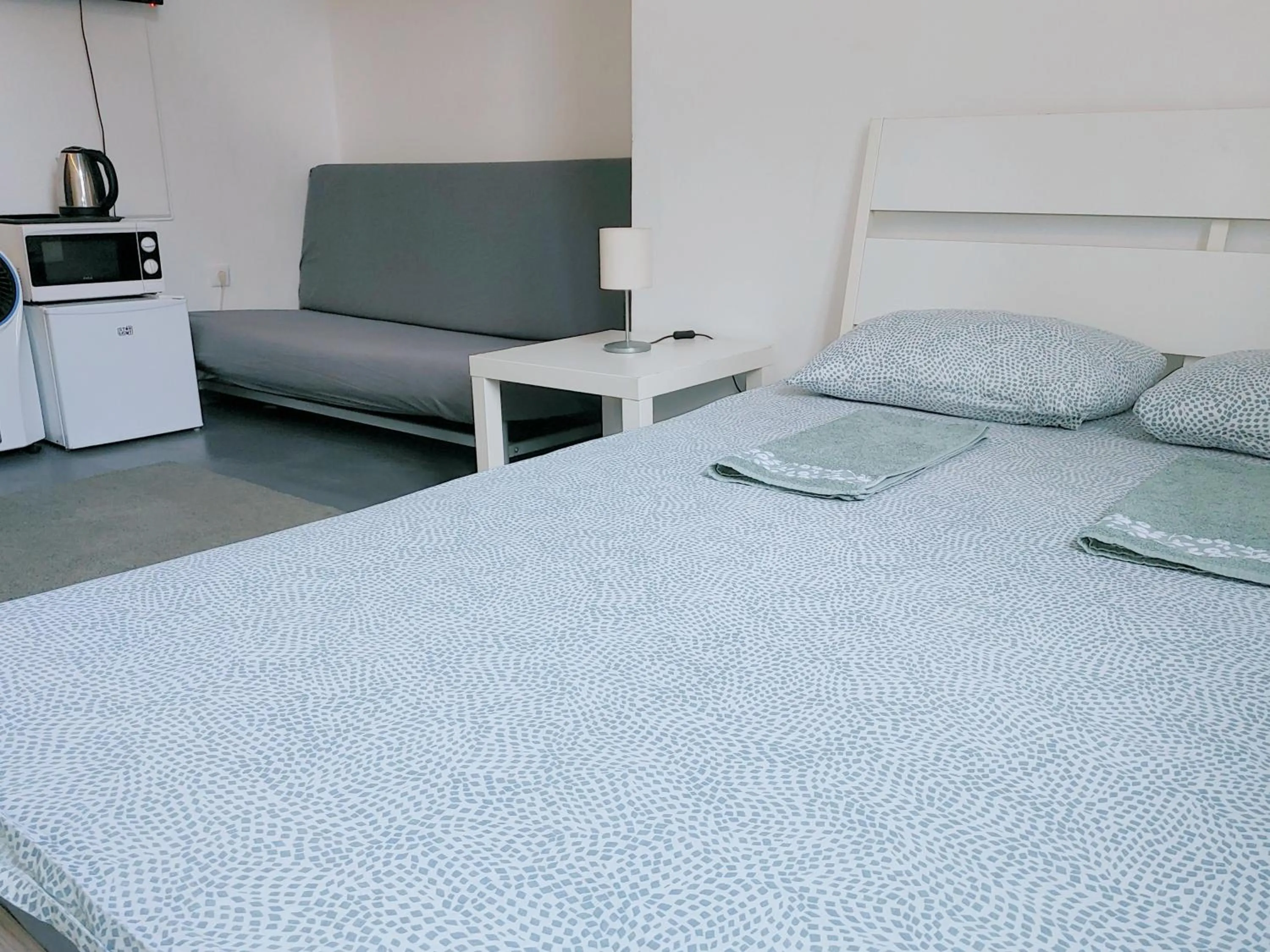 Bed in Sleepover City Center GuestRooms