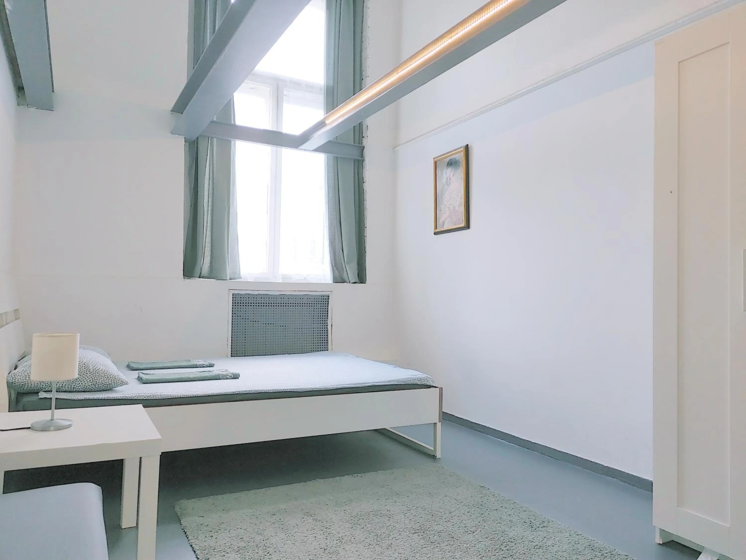 Bed in Sleepover City Center GuestRooms