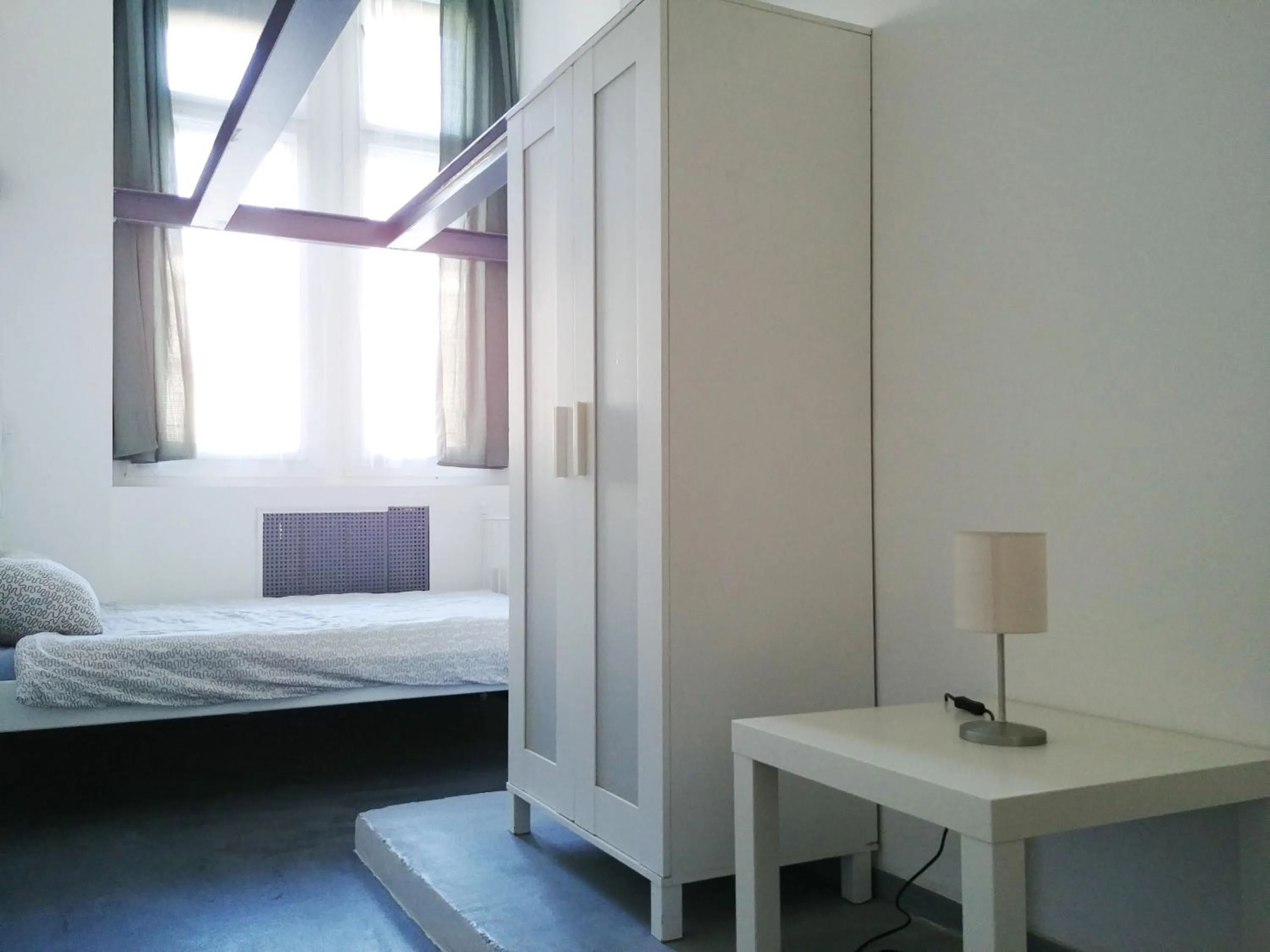 Bed in Sleepover City Center GuestRooms