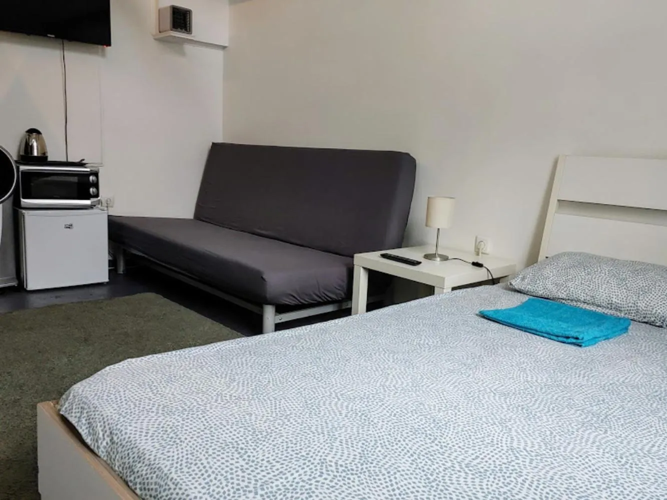 Bed in Sleepover City Center GuestRooms