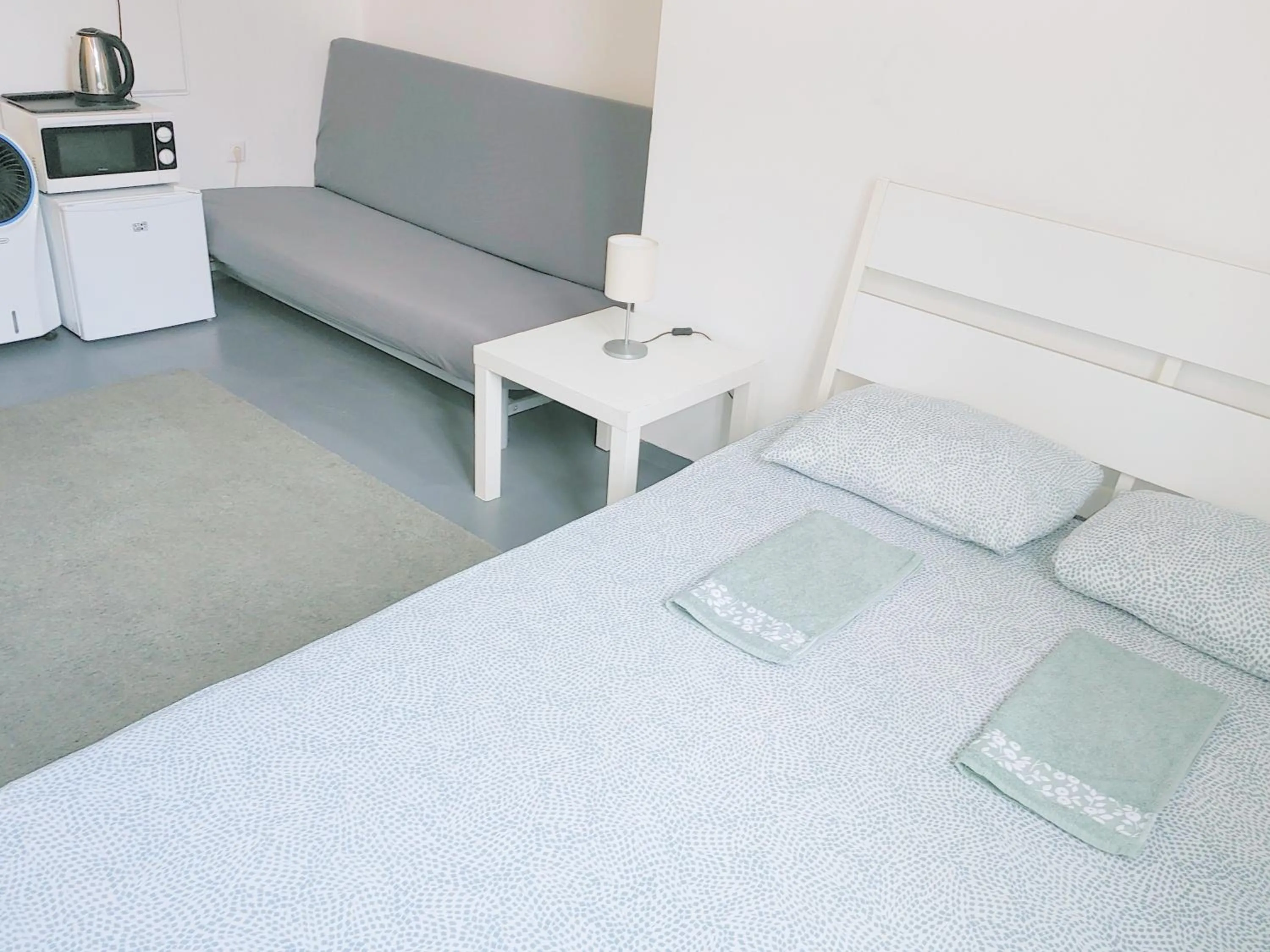 Bed in Sleepover City Center GuestRooms