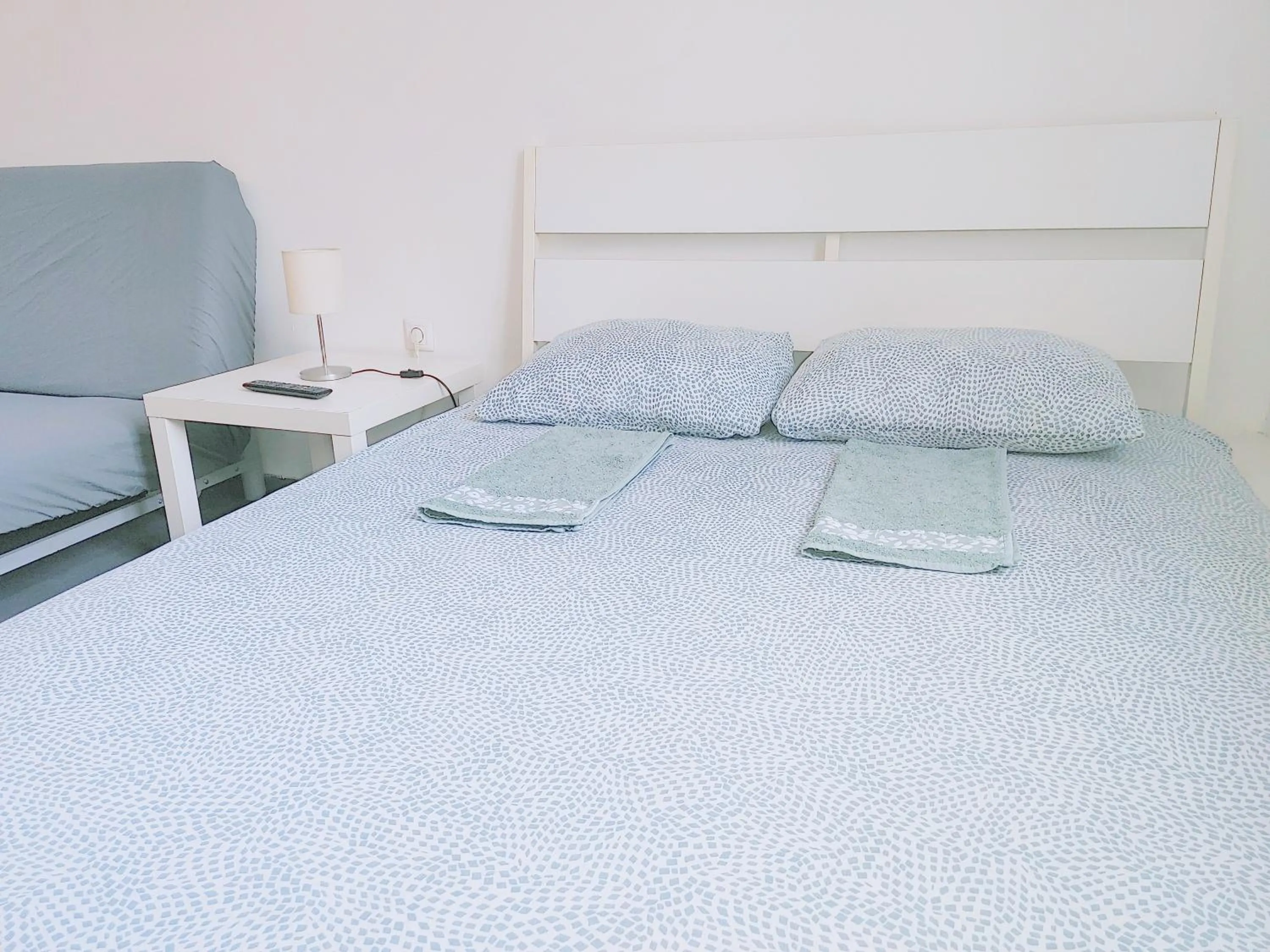 Bed in Sleepover City Center GuestRooms