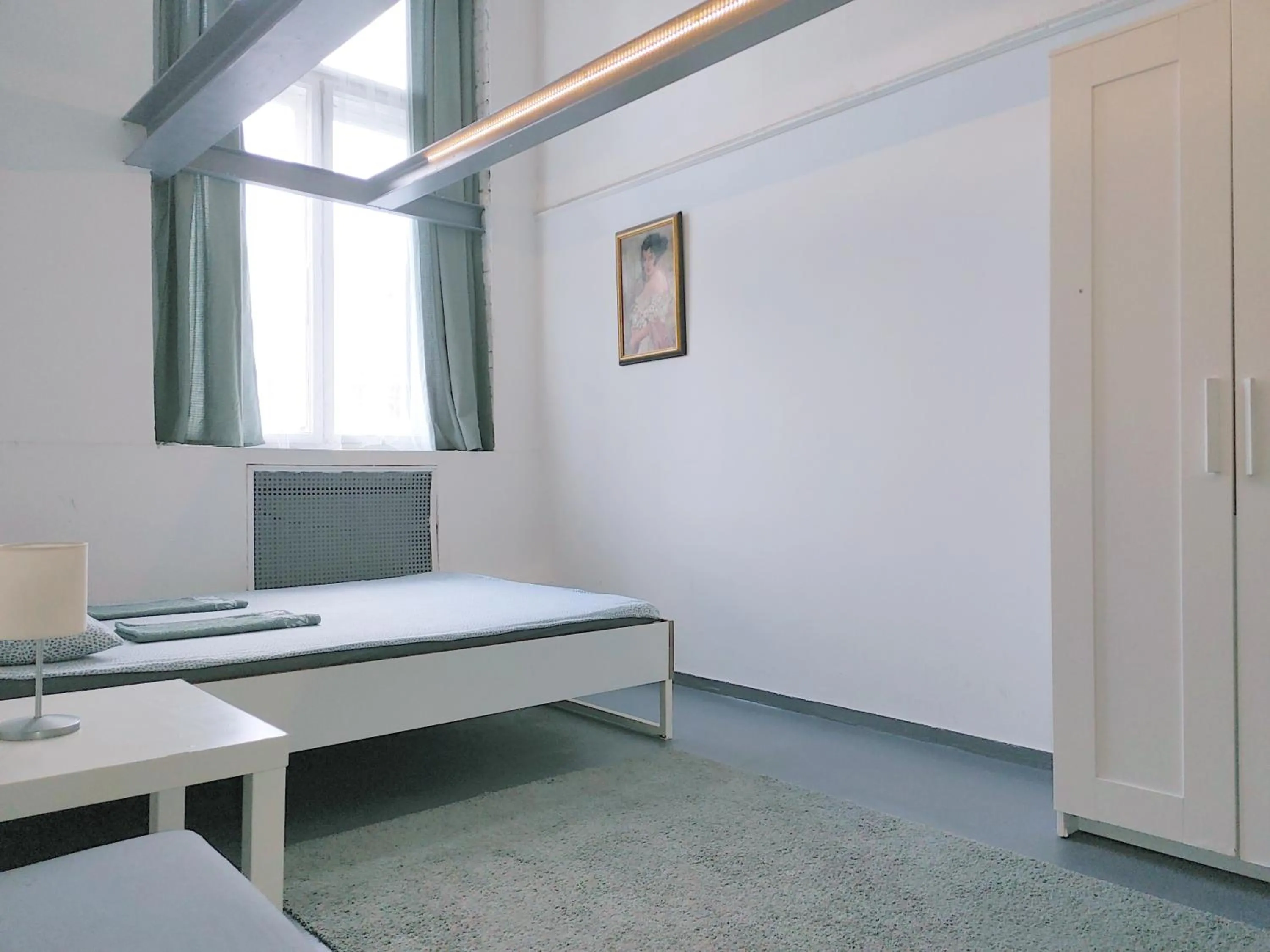 Bed in Sleepover City Center GuestRooms