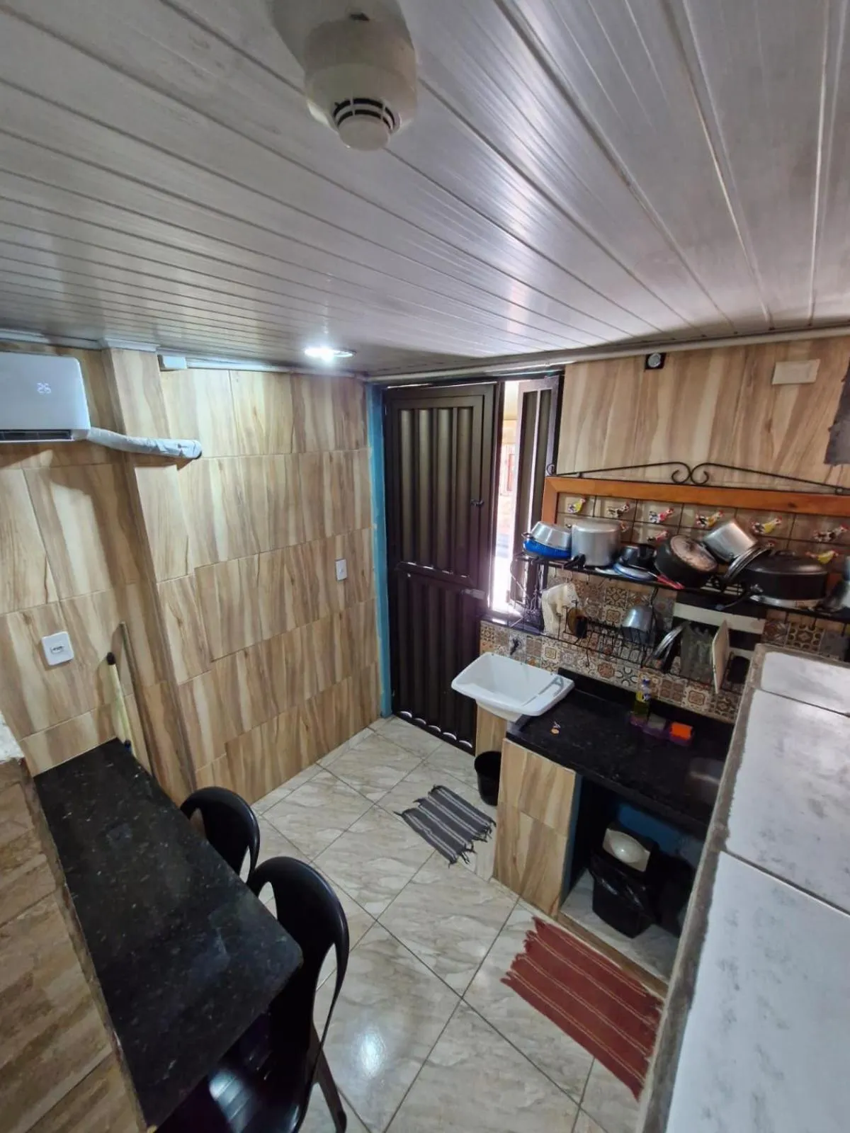 Kitchen or kitchenette in Kitnets com AR Condicionado na Praia