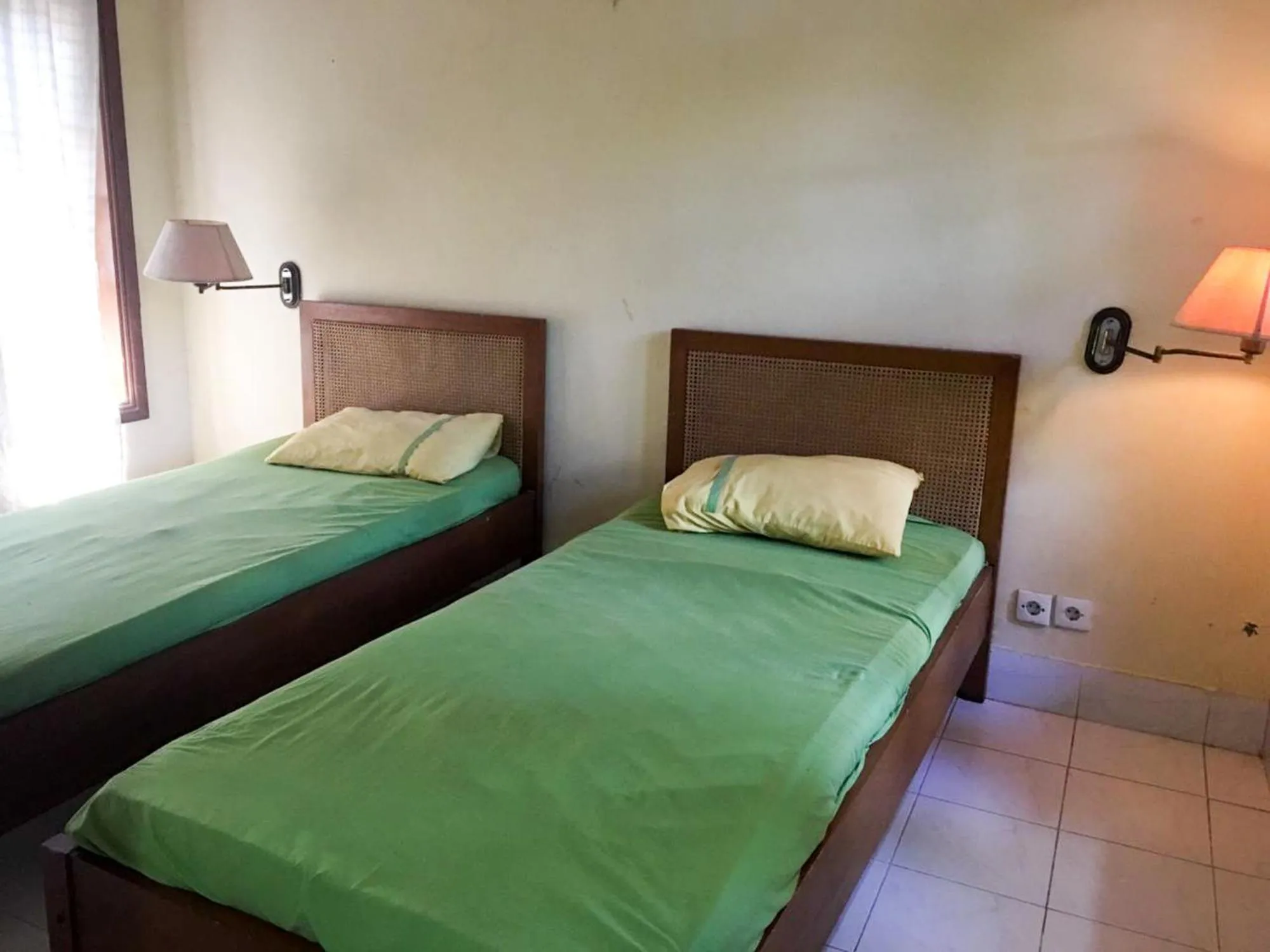 Bed in Sari Bali Resort