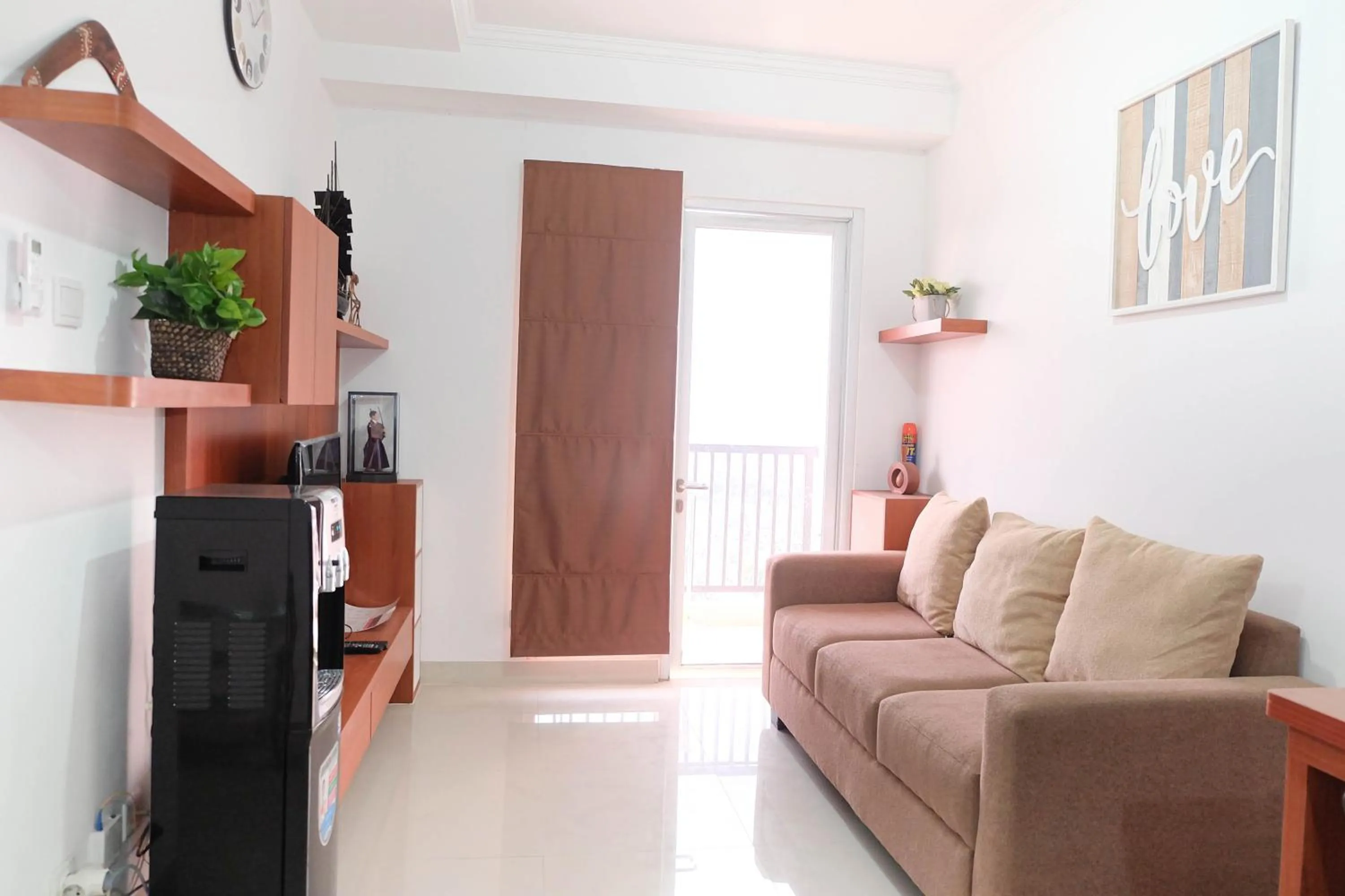 Living room in Fabulous 2BR Signature Park Grande Apartment By Travelio