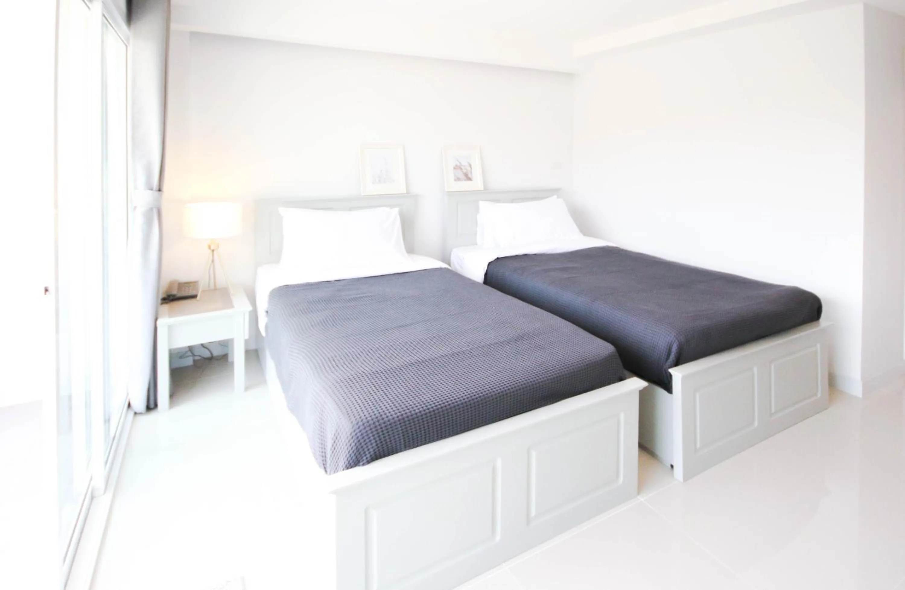 Bed in Tonkla Boutique Hotel