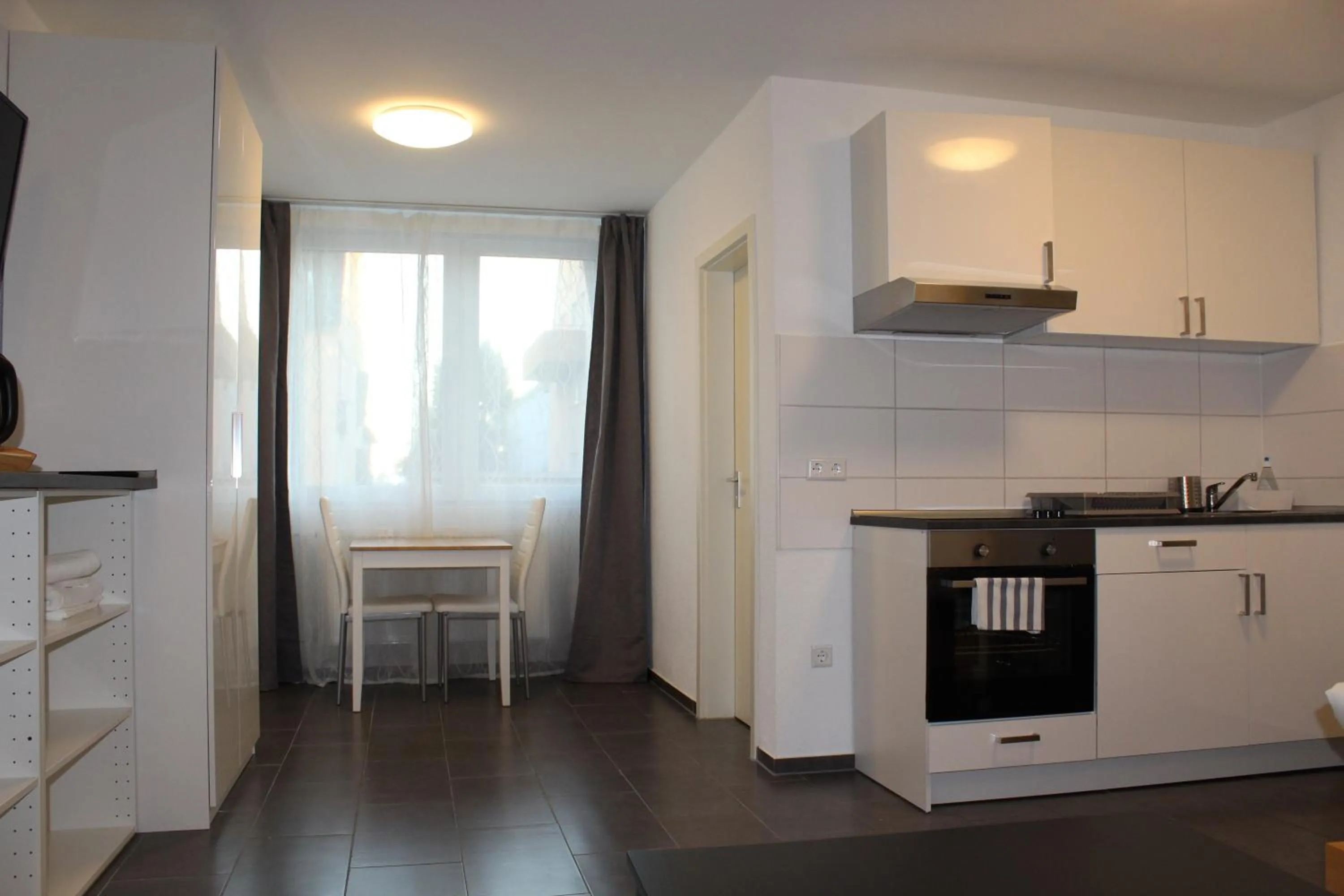 Kitchen or kitchenette in Libarty Appartments
