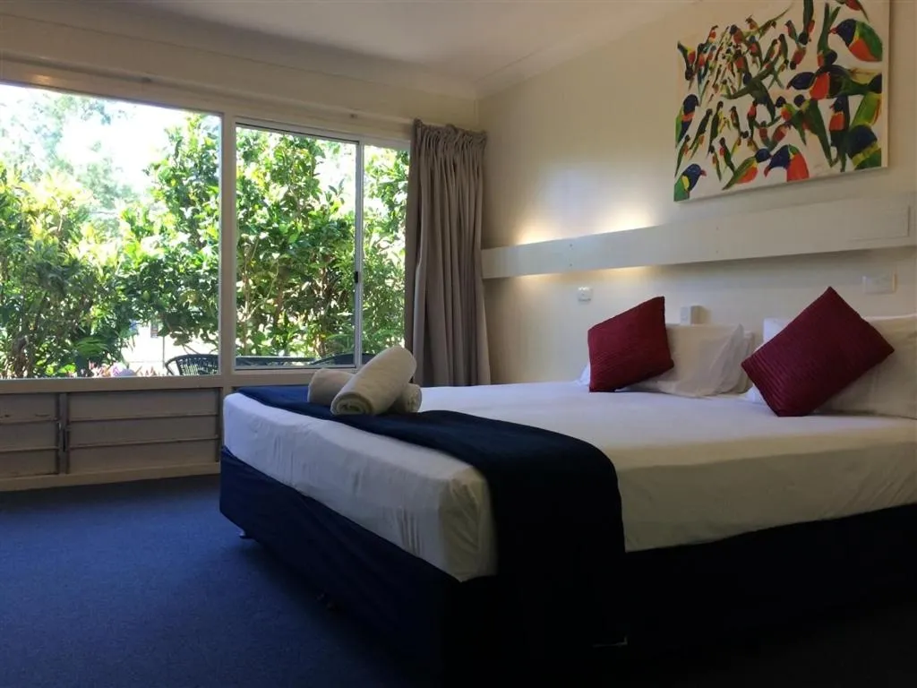 Bed in Arcadia Village Motel