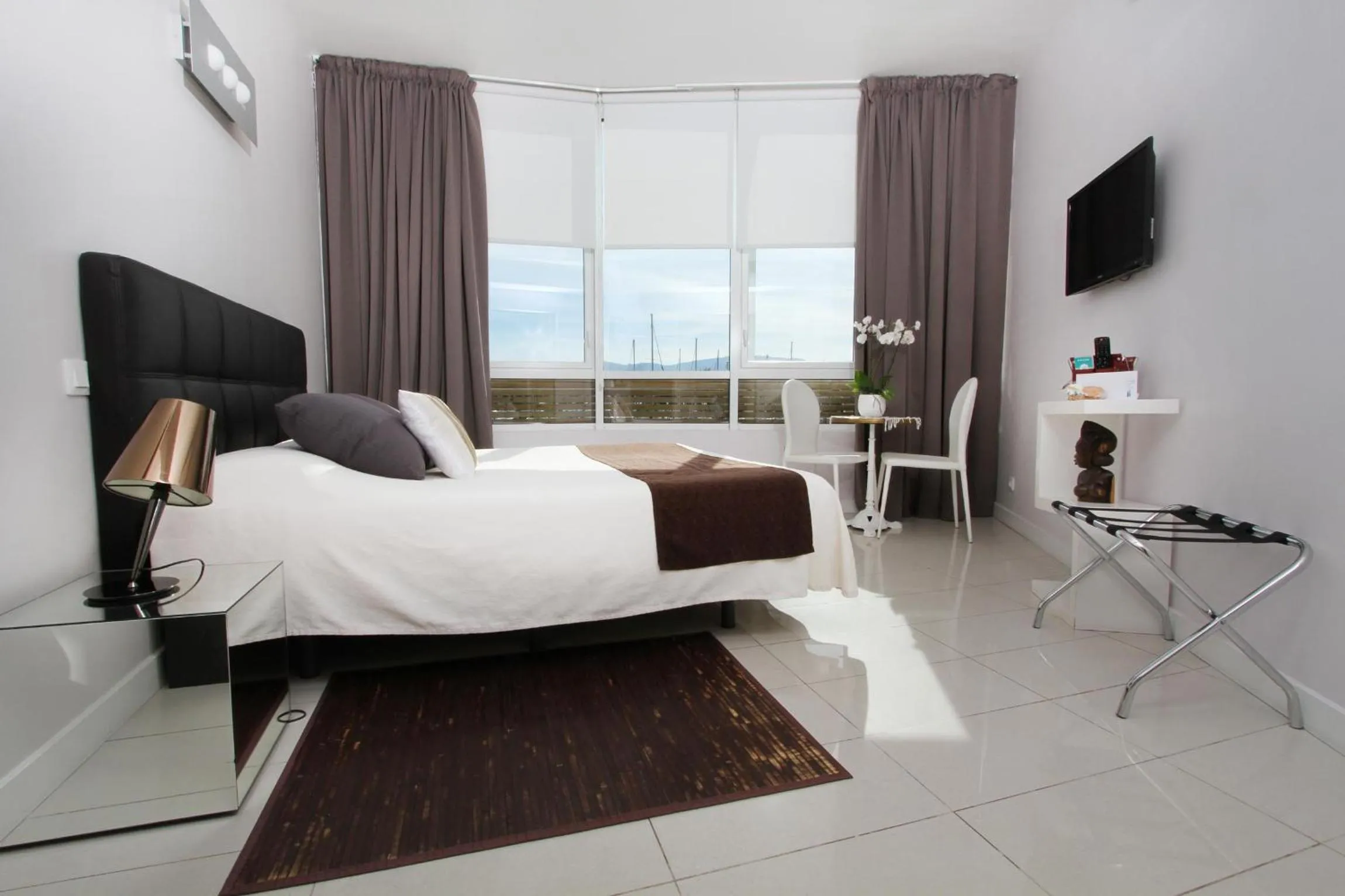 Photo of the whole room, Bed in Bleu Mer Duplex & Suites