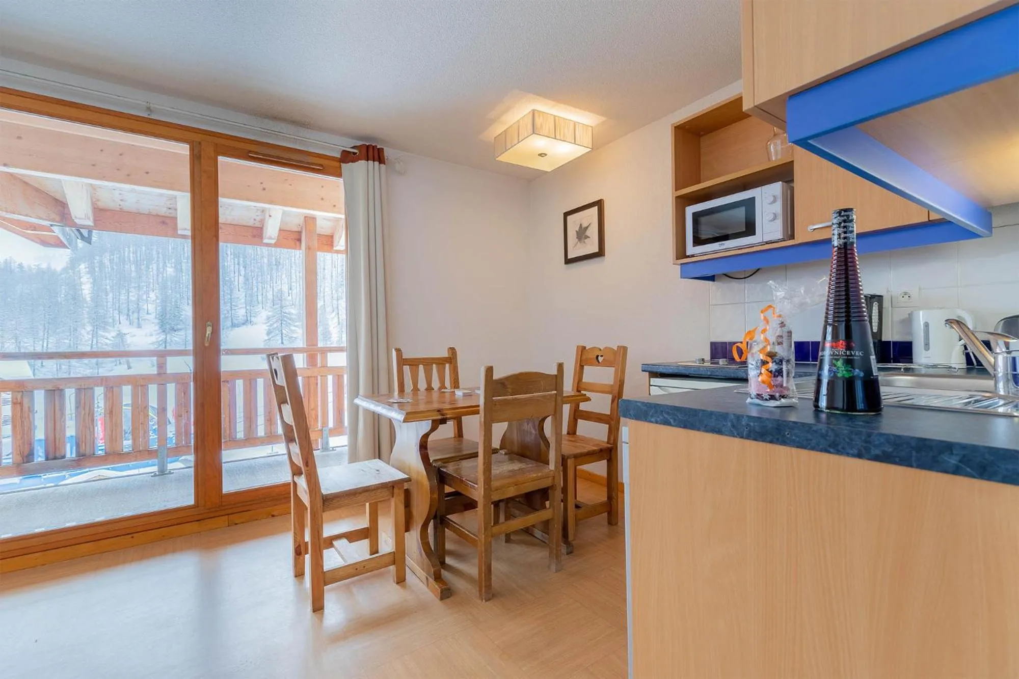 Kitchen or kitchenette in Madame Vacances Résidence Le Parc Des Airelles