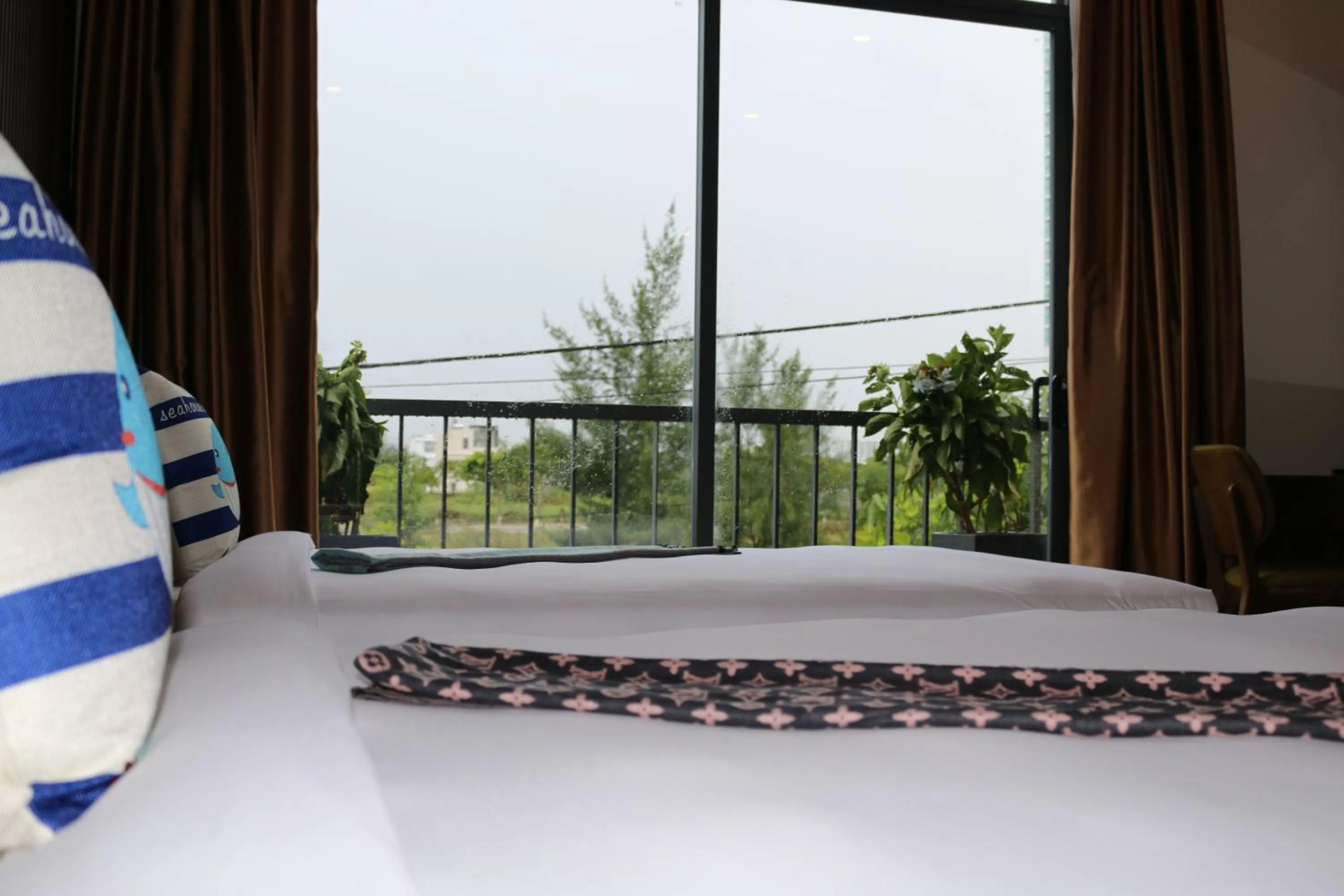 Bed in The Fish Village Villa