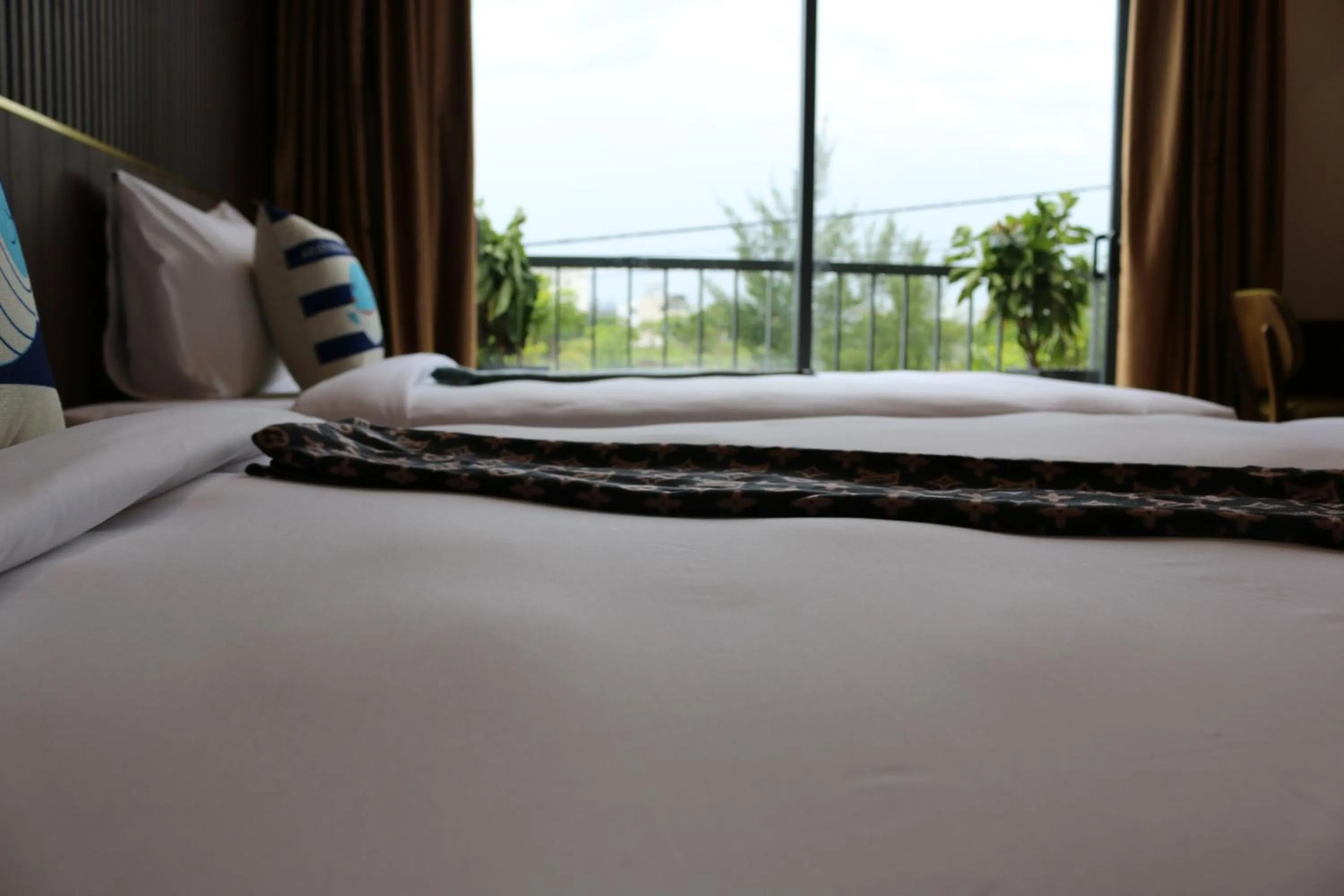 Bed in The Fish Village Villa