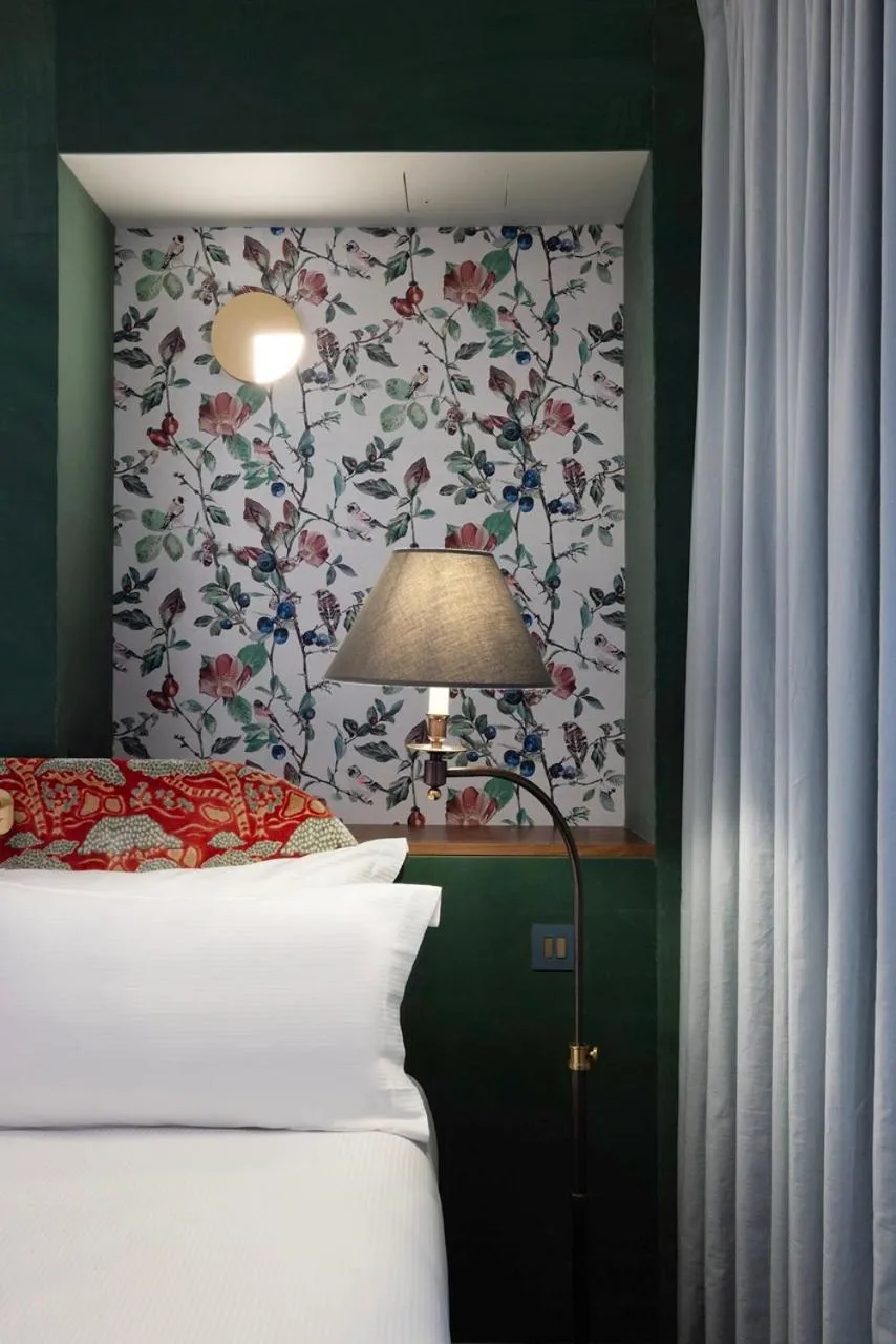 Bed in Hotel L de Lutece - Notre-Dame