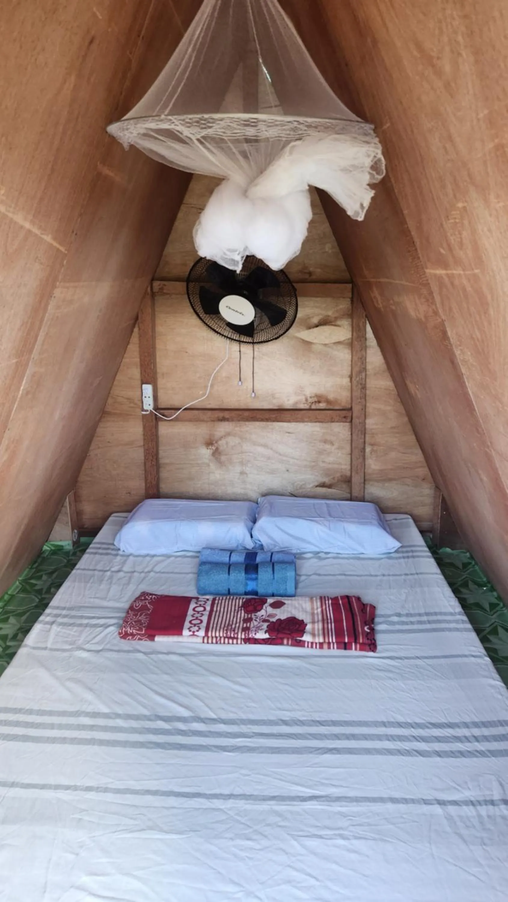 Bed in Nirvana Bamboo & Dive resort