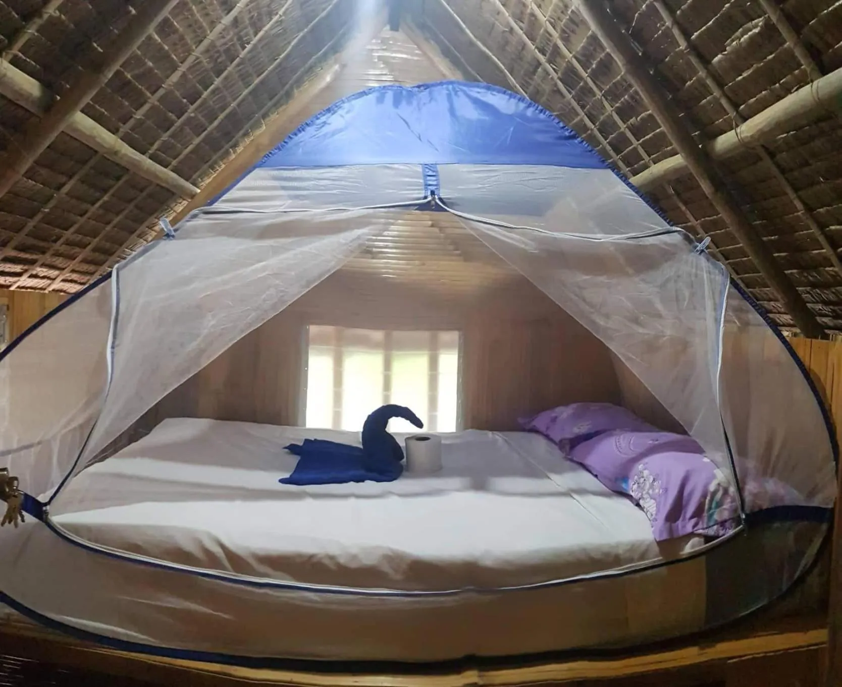 Bed in Nirvana Bamboo & Dive resort