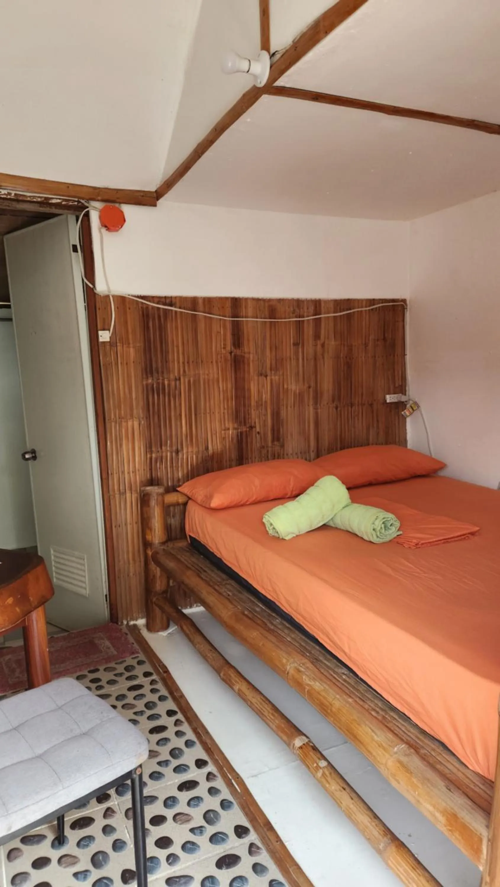 Bed in Nirvana Bamboo & Dive resort