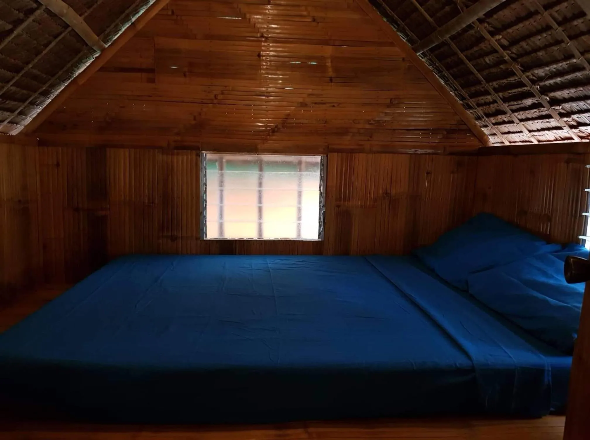 Bed in Nirvana Bamboo & Dive resort