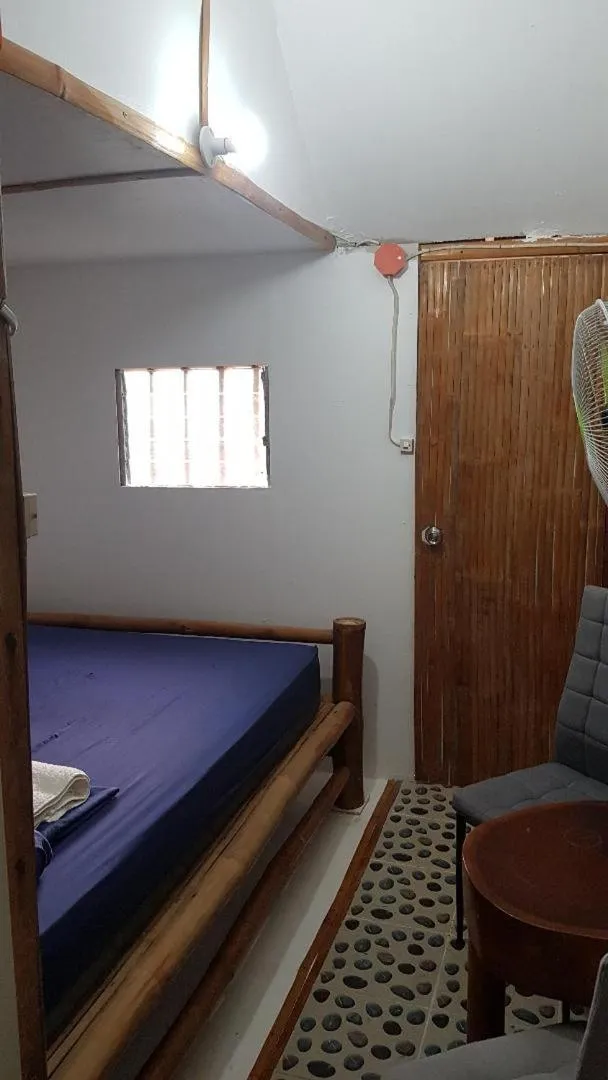 Bed in Nirvana Bamboo & Dive resort