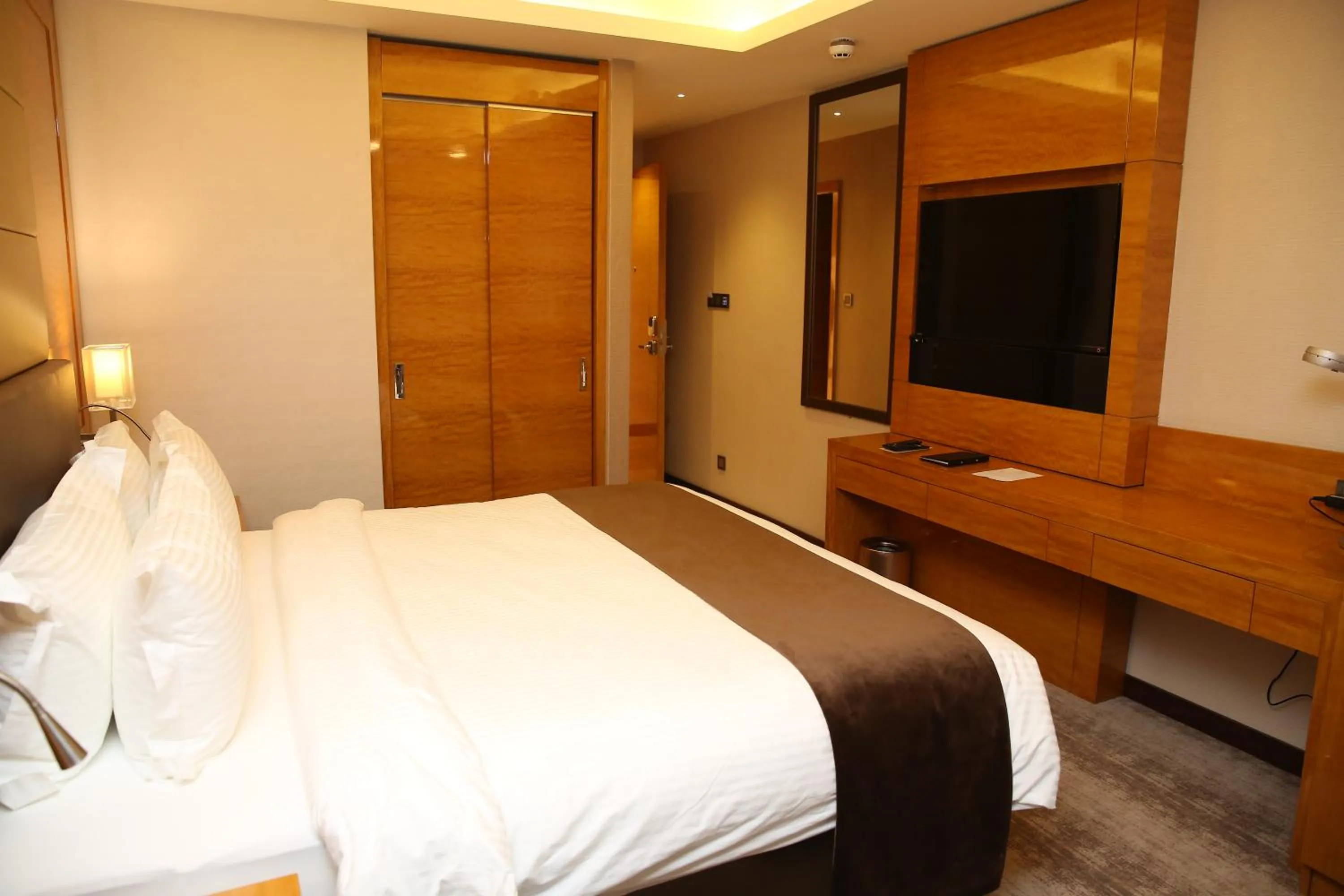 Bed in Gloria Hotel Amman