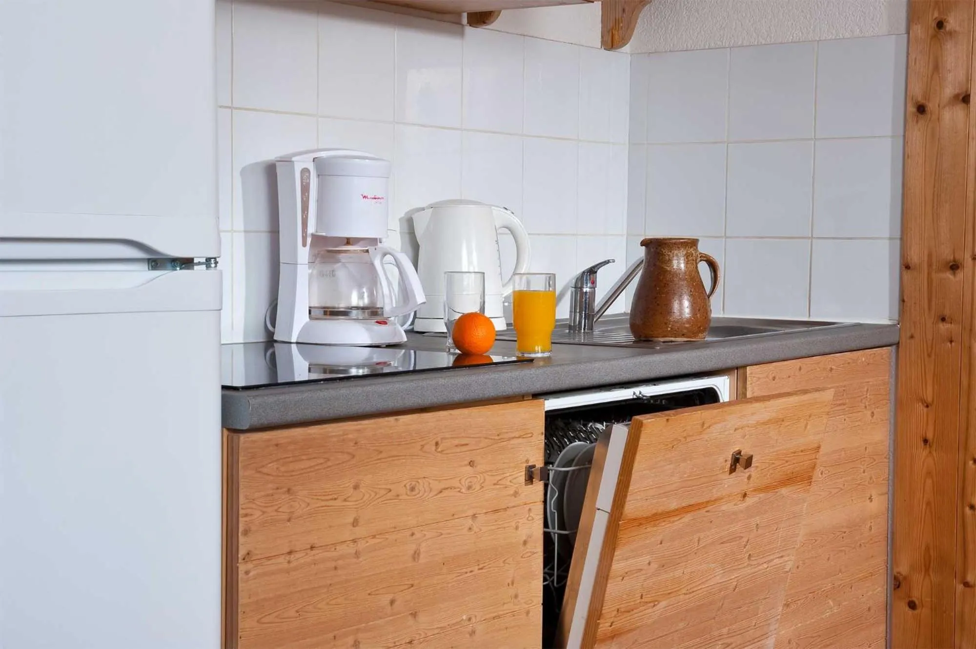 Kitchen or kitchenette in Madame Vacances Les Chalets Du Berger