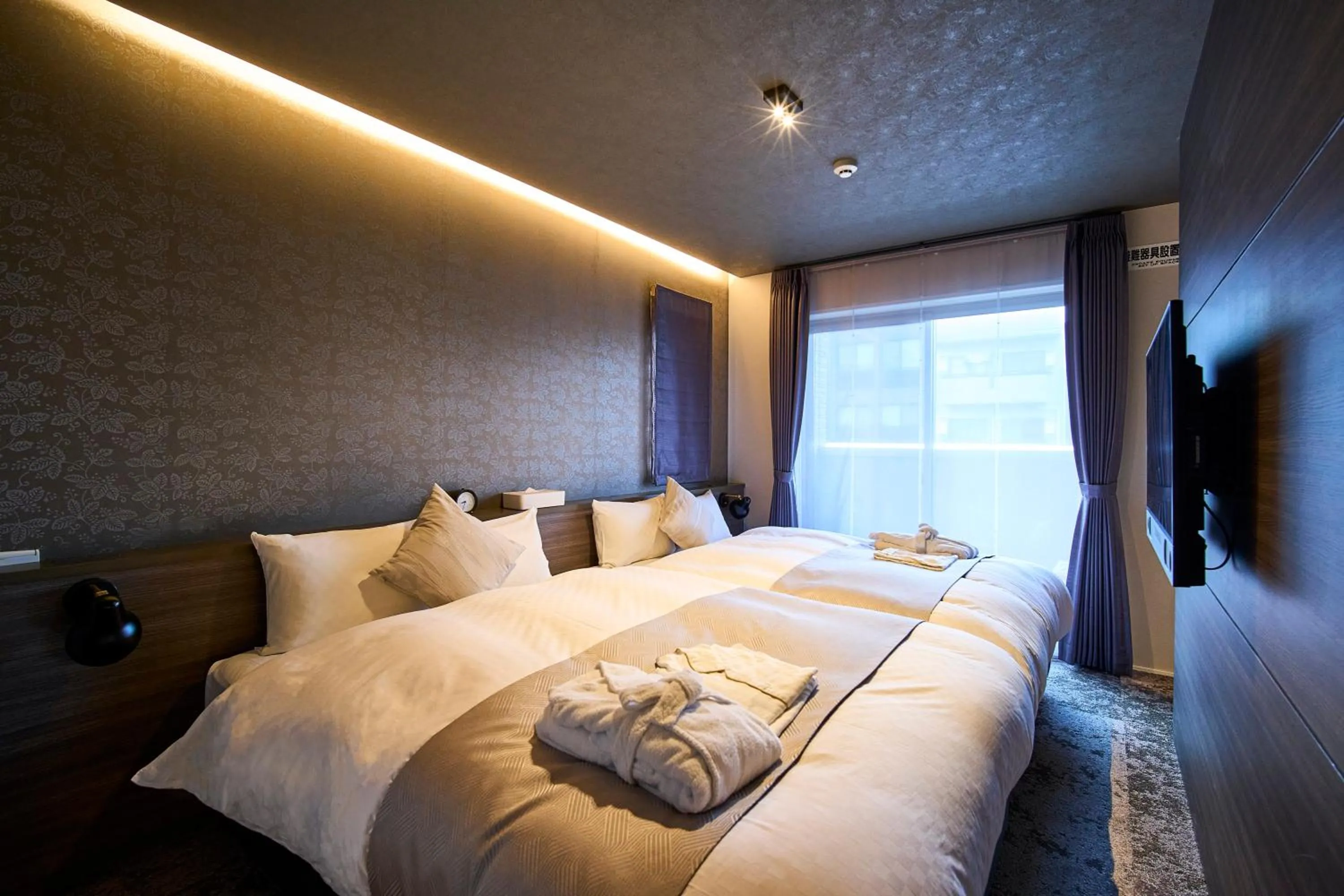 Bed in HOTEL MASTAY jingumichi