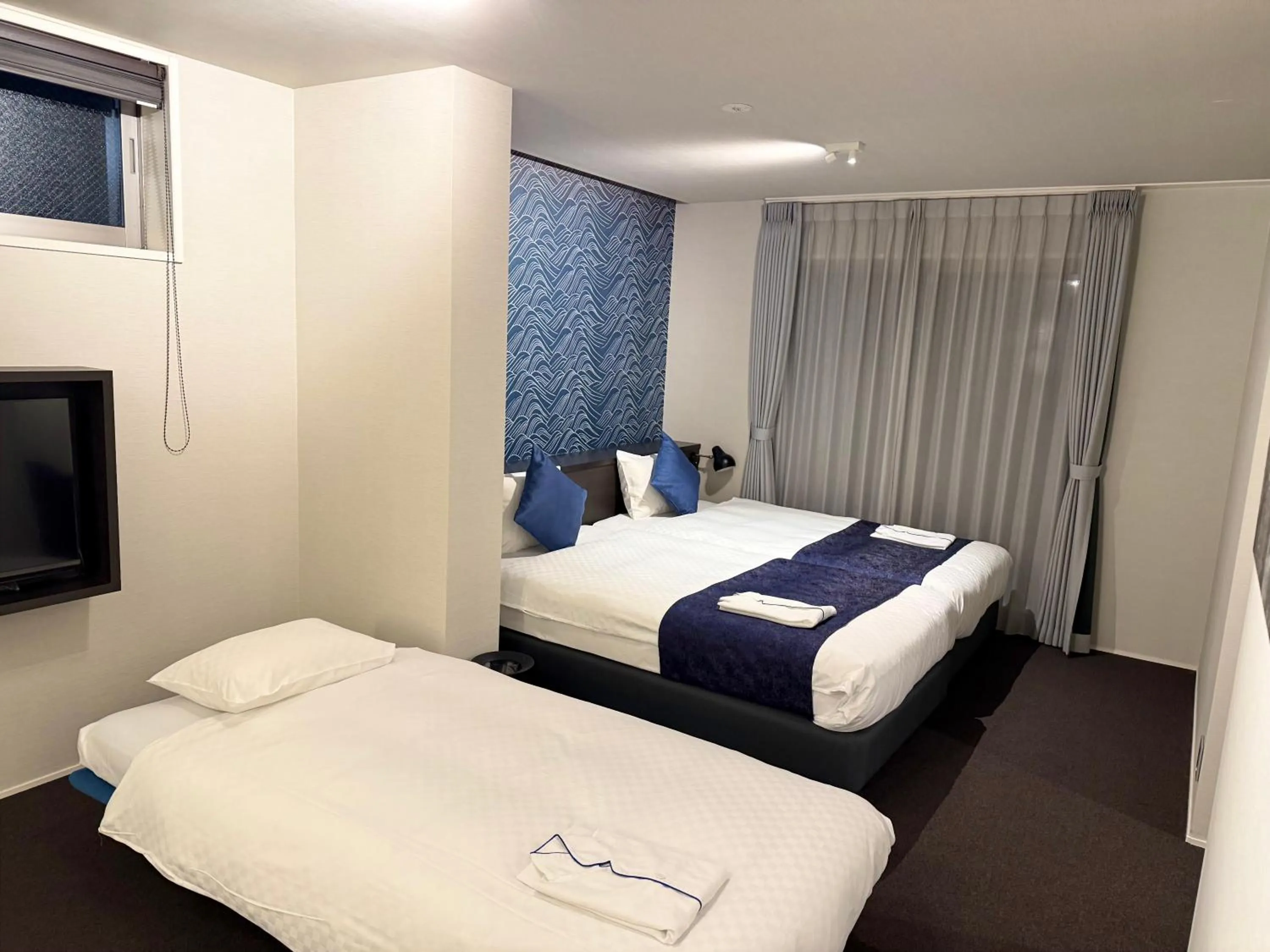 Bed in HOTEL MASTAY jingumichi