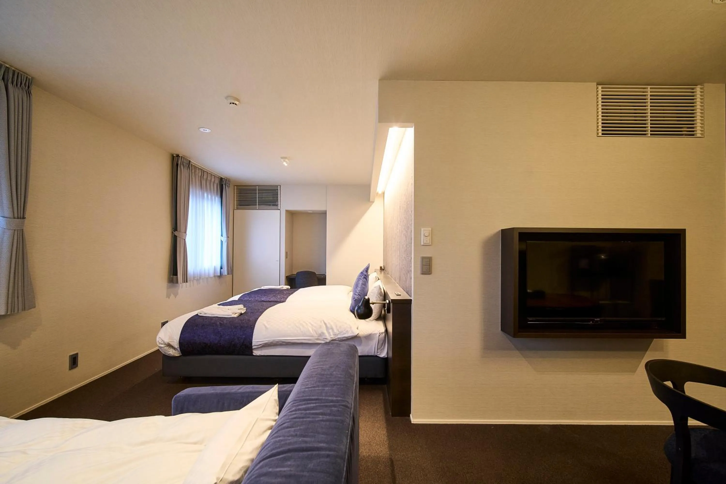 Bed in HOTEL MASTAY jingumichi