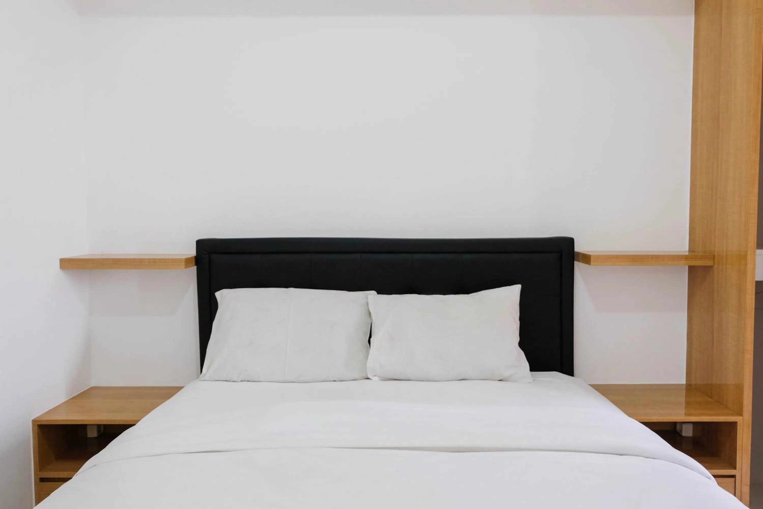 Bed in Comfortable 2BR Apartment at M-Town Residence By Travelio