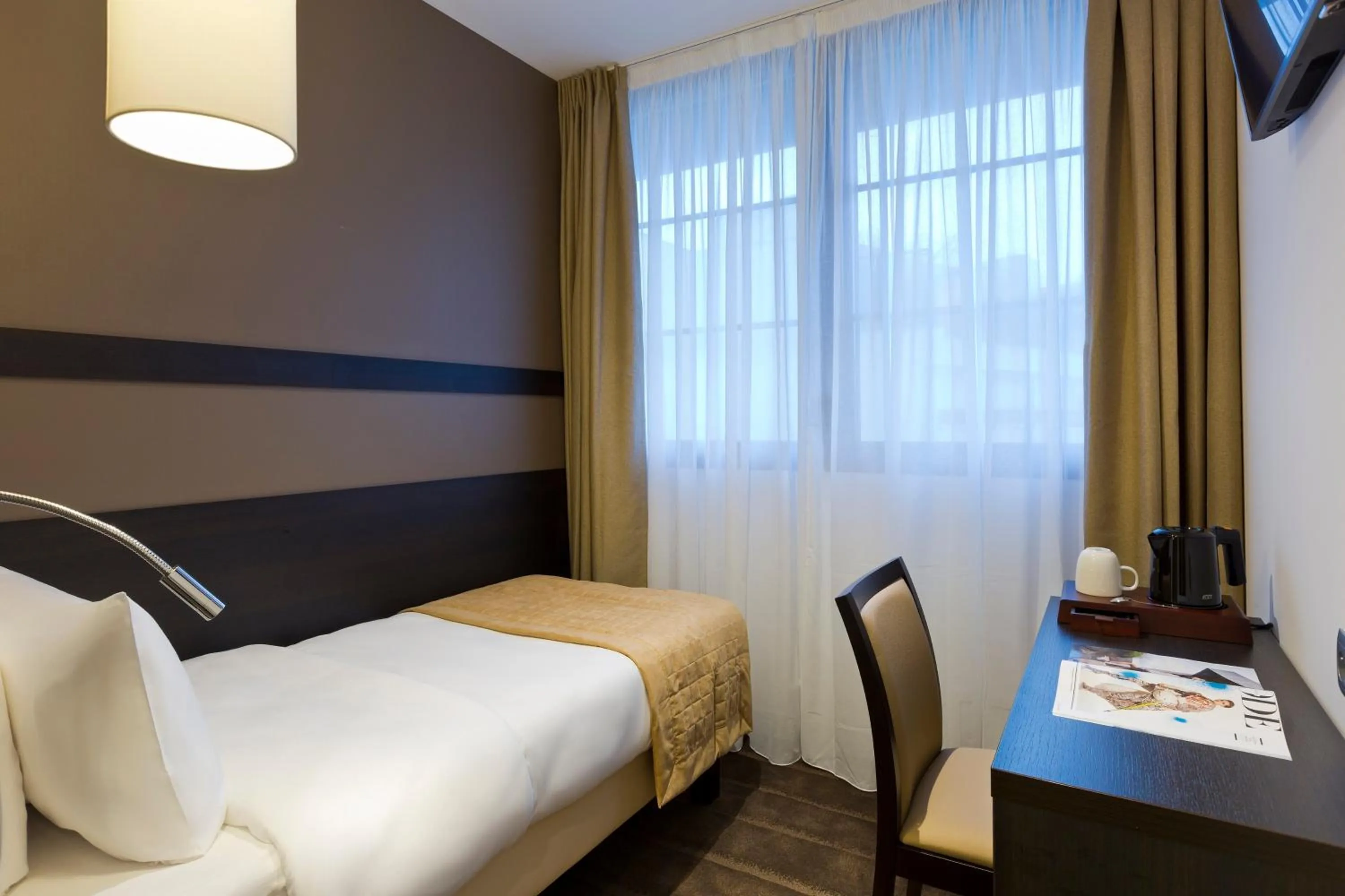 Bed in Simon's Boutique Hôtel