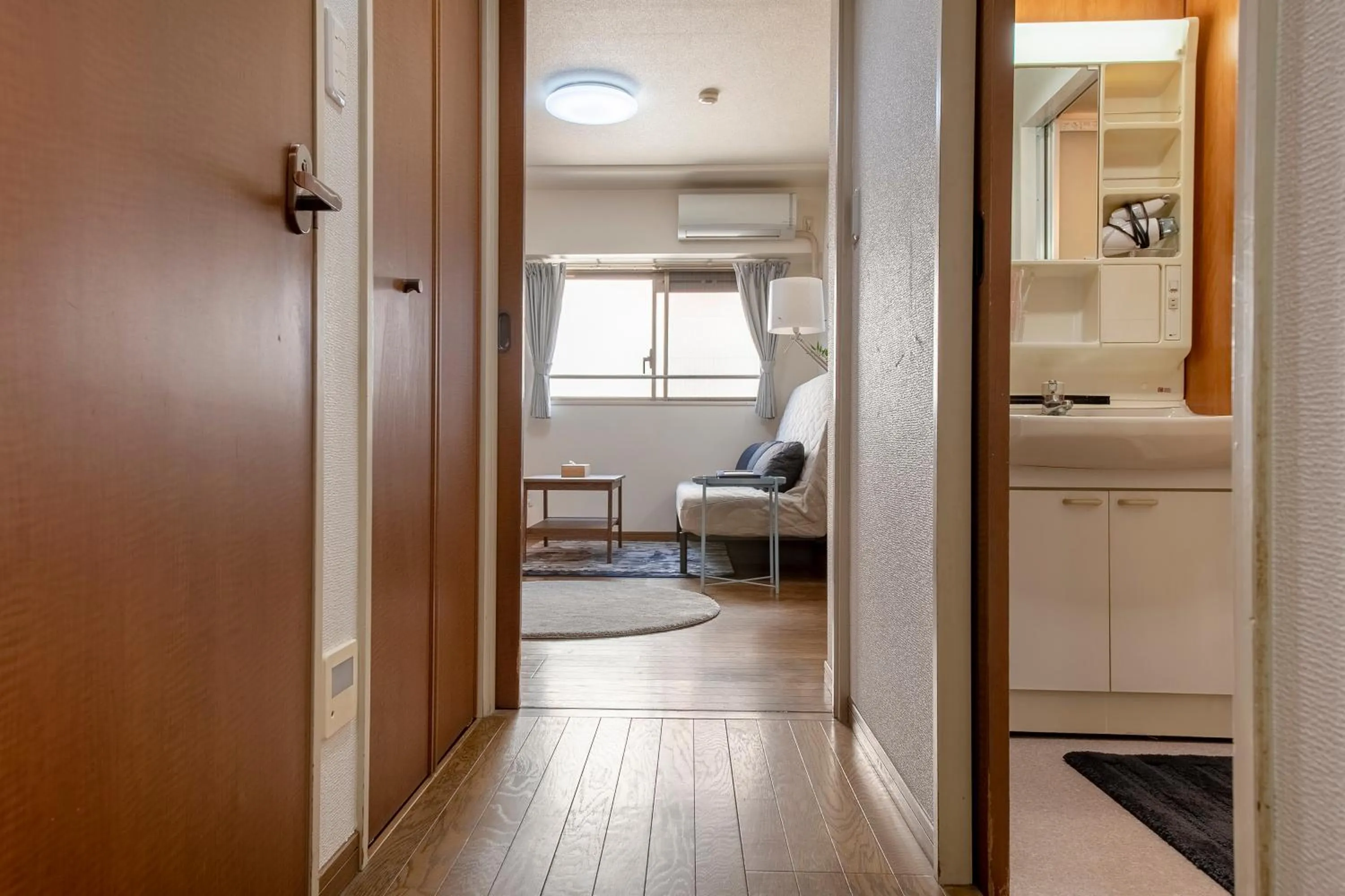 Bed in Uhome Akihabara Apartment 3