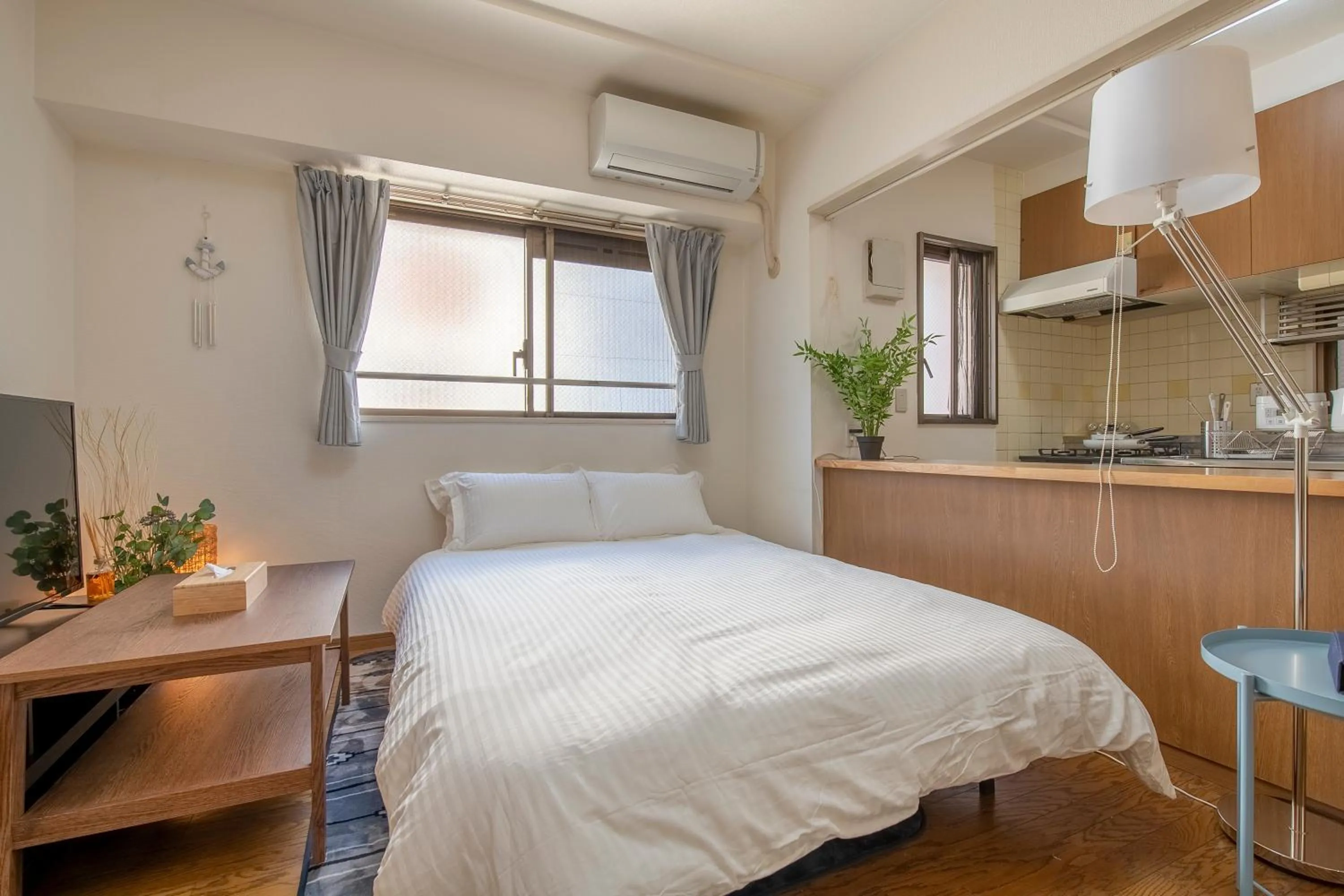 Bed in Uhome Akihabara Apartment 3