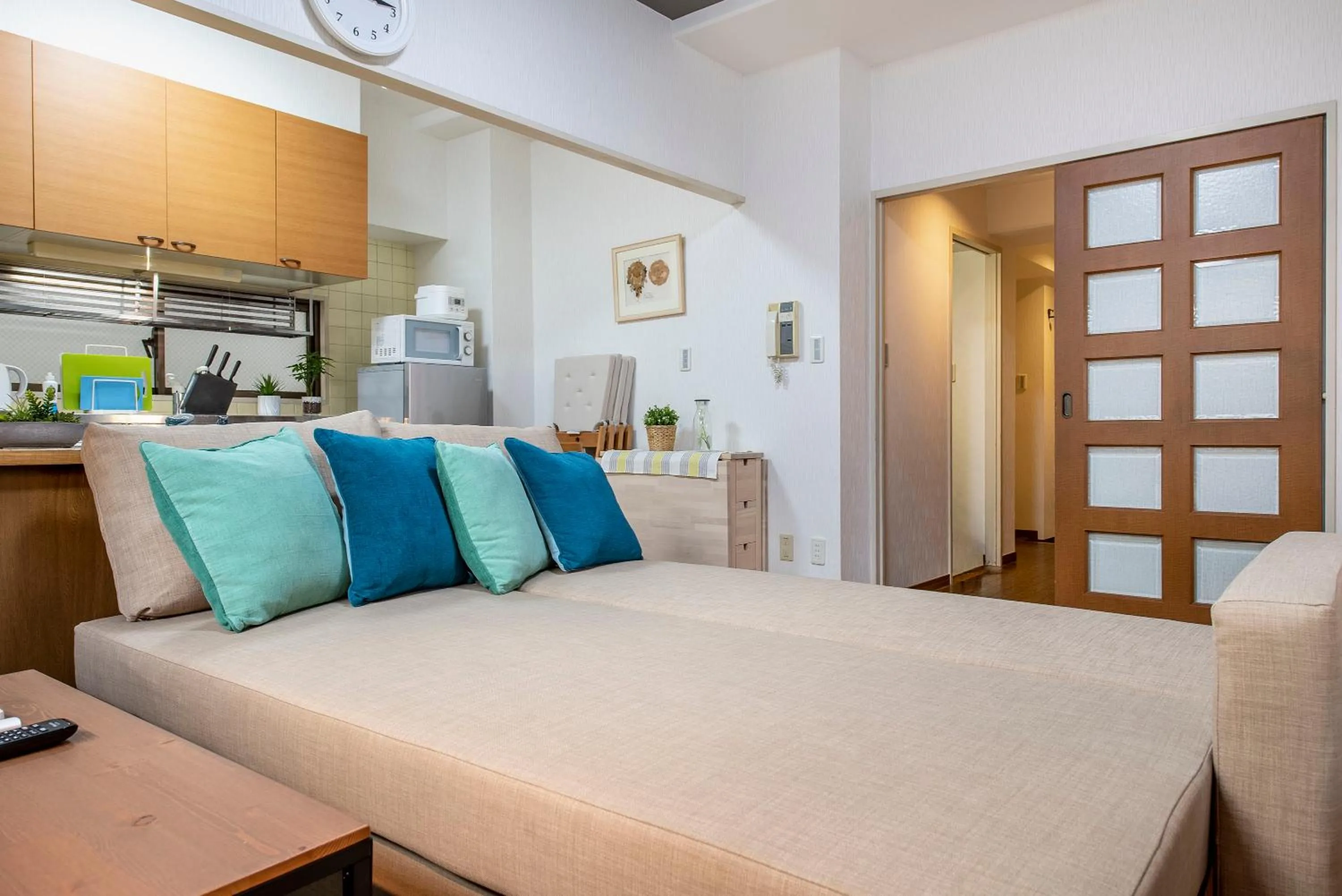 Bed in Uhome Akihabara Apartment 3