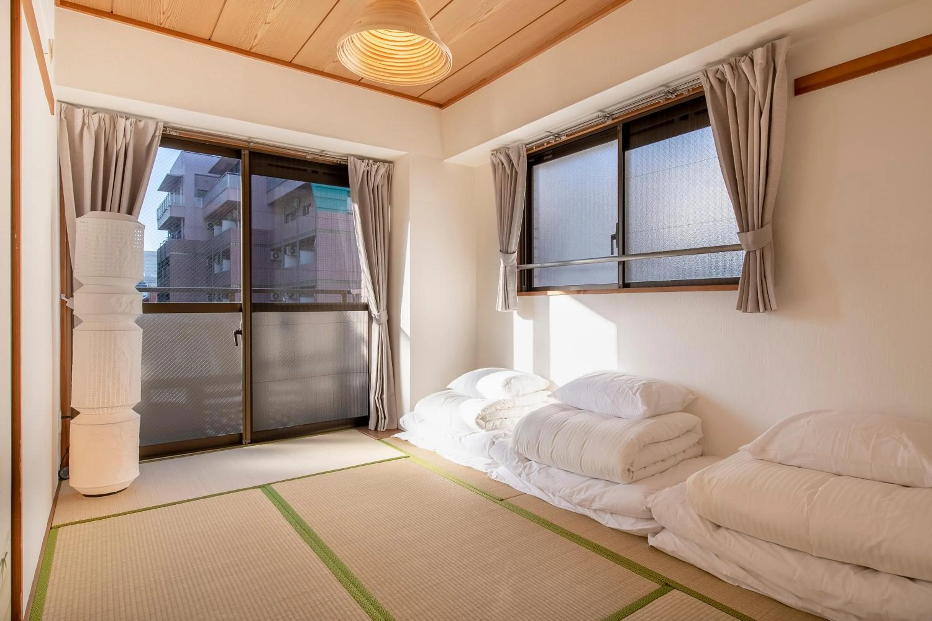 Bed in Uhome Akihabara Apartment 3