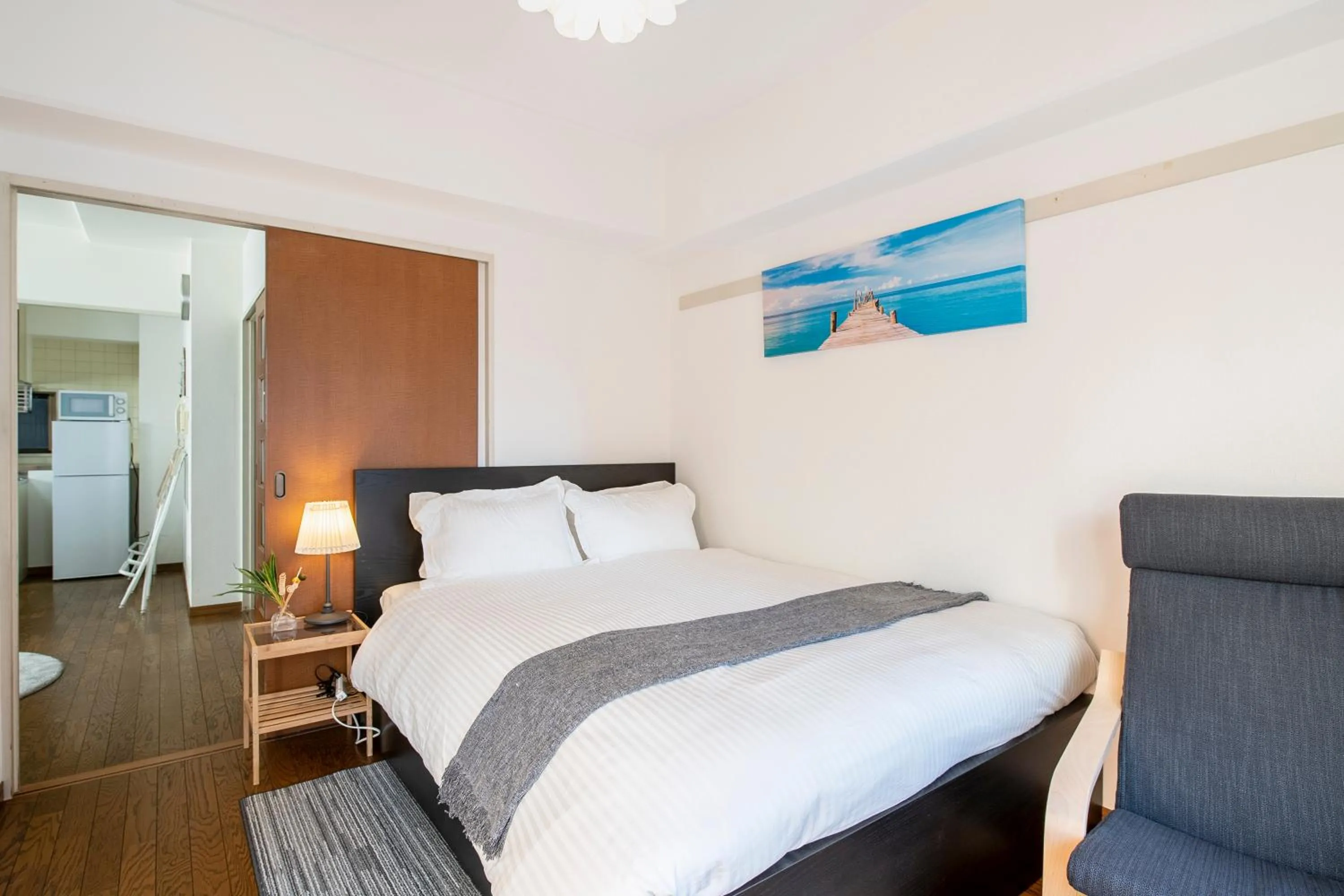 Bed in Uhome Akihabara Apartment 3