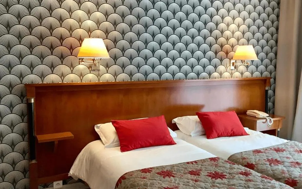 Bed in Logis Hotel Diana