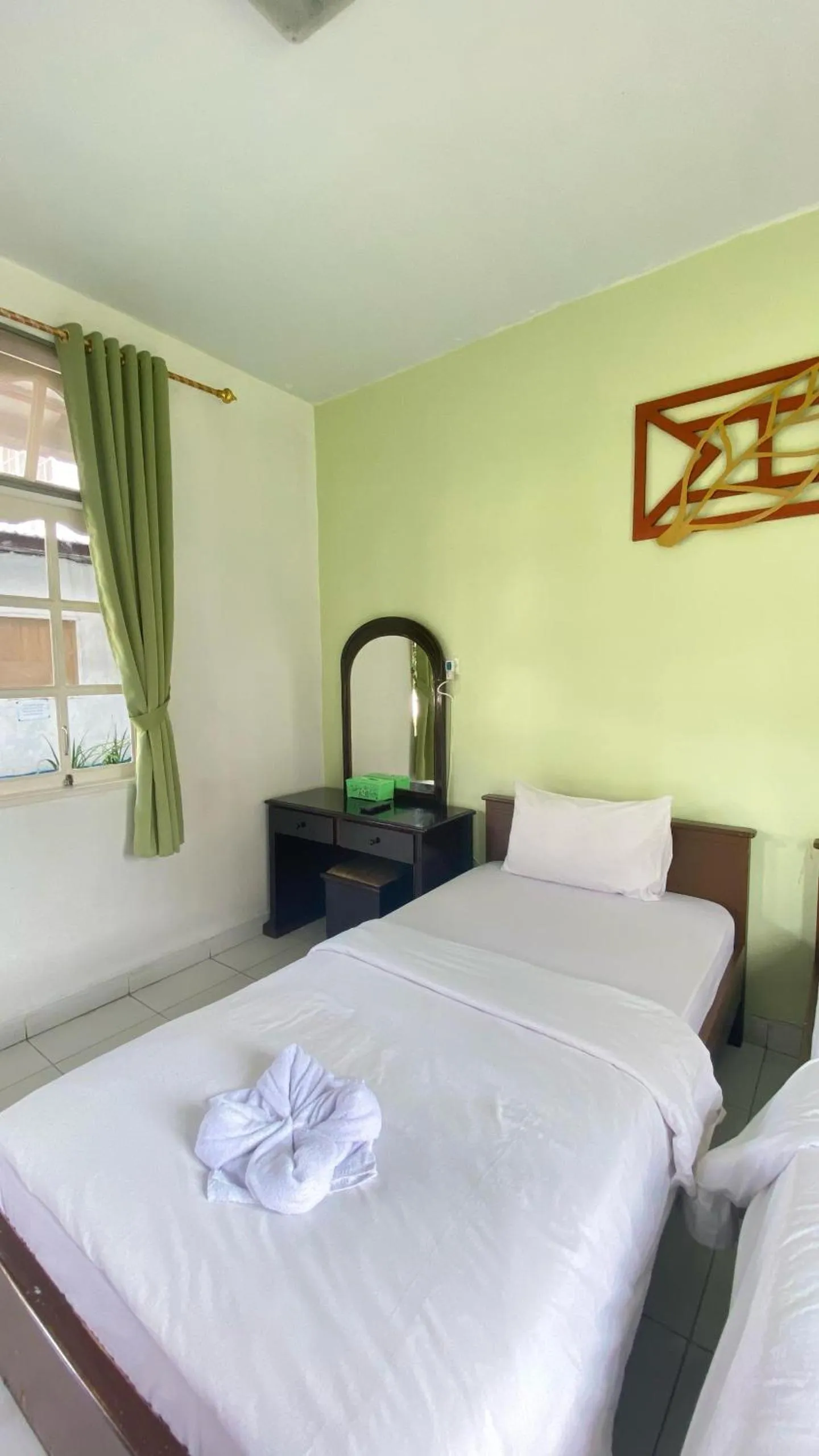 Bed in Hotel Ompu Herti