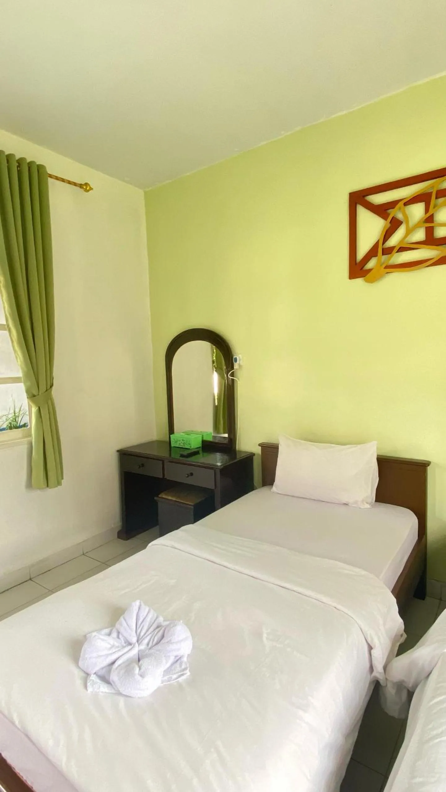 Bed in Hotel Ompu Herti