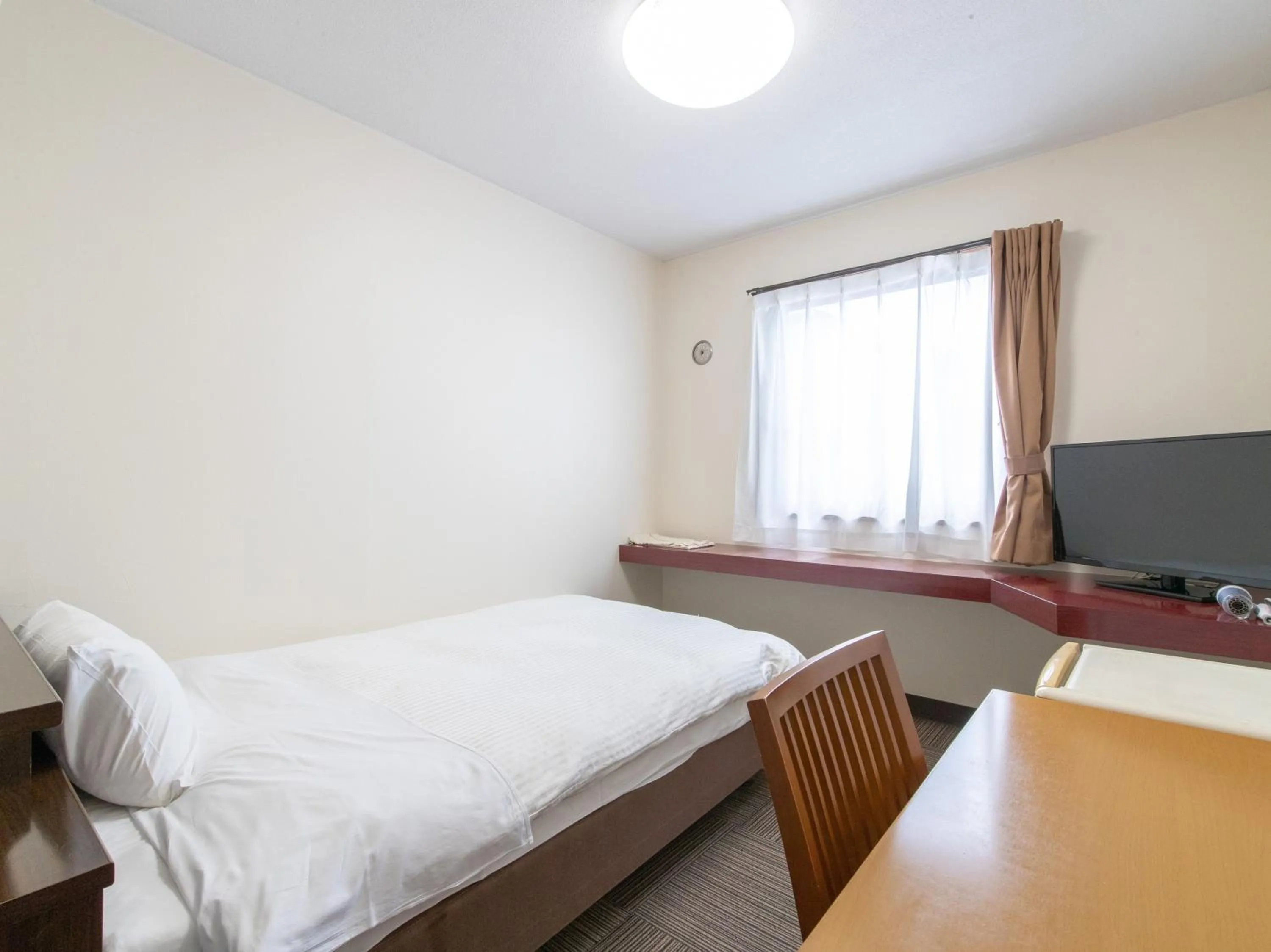 Photo of the whole room, Bed in Tabist Rays Hotel Suisen