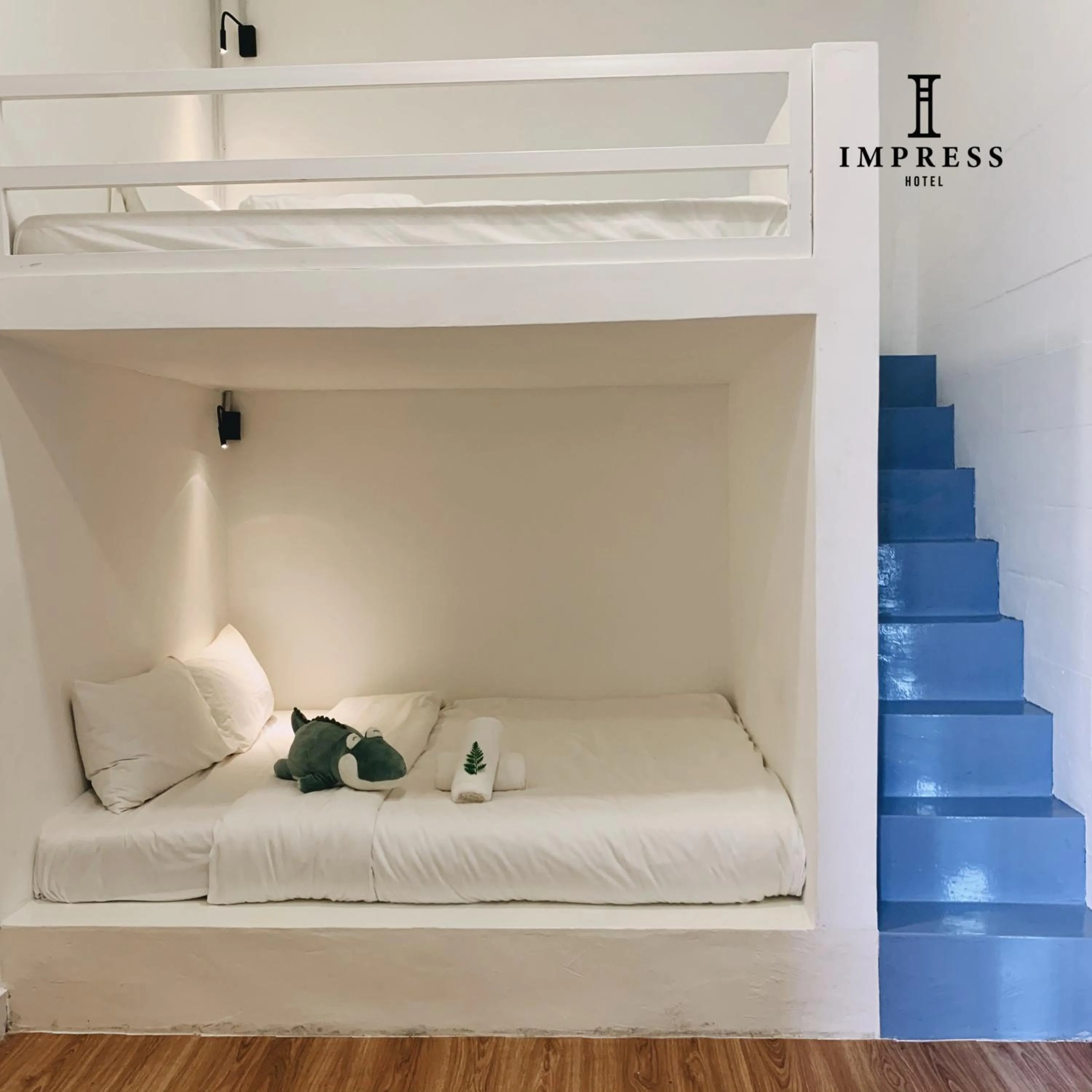 Bed in IMPRESS HOTEL