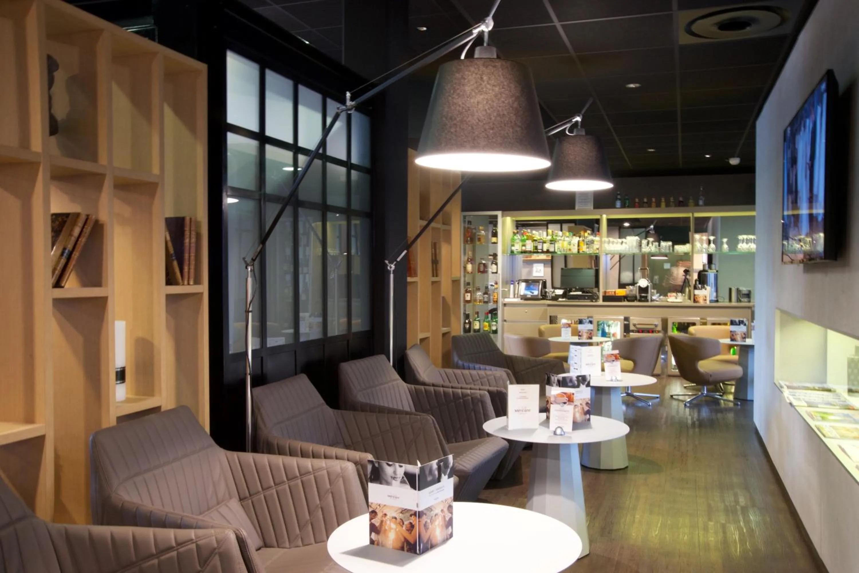 Communal lounge/ TV room in Mercure Périgueux Centre Historique