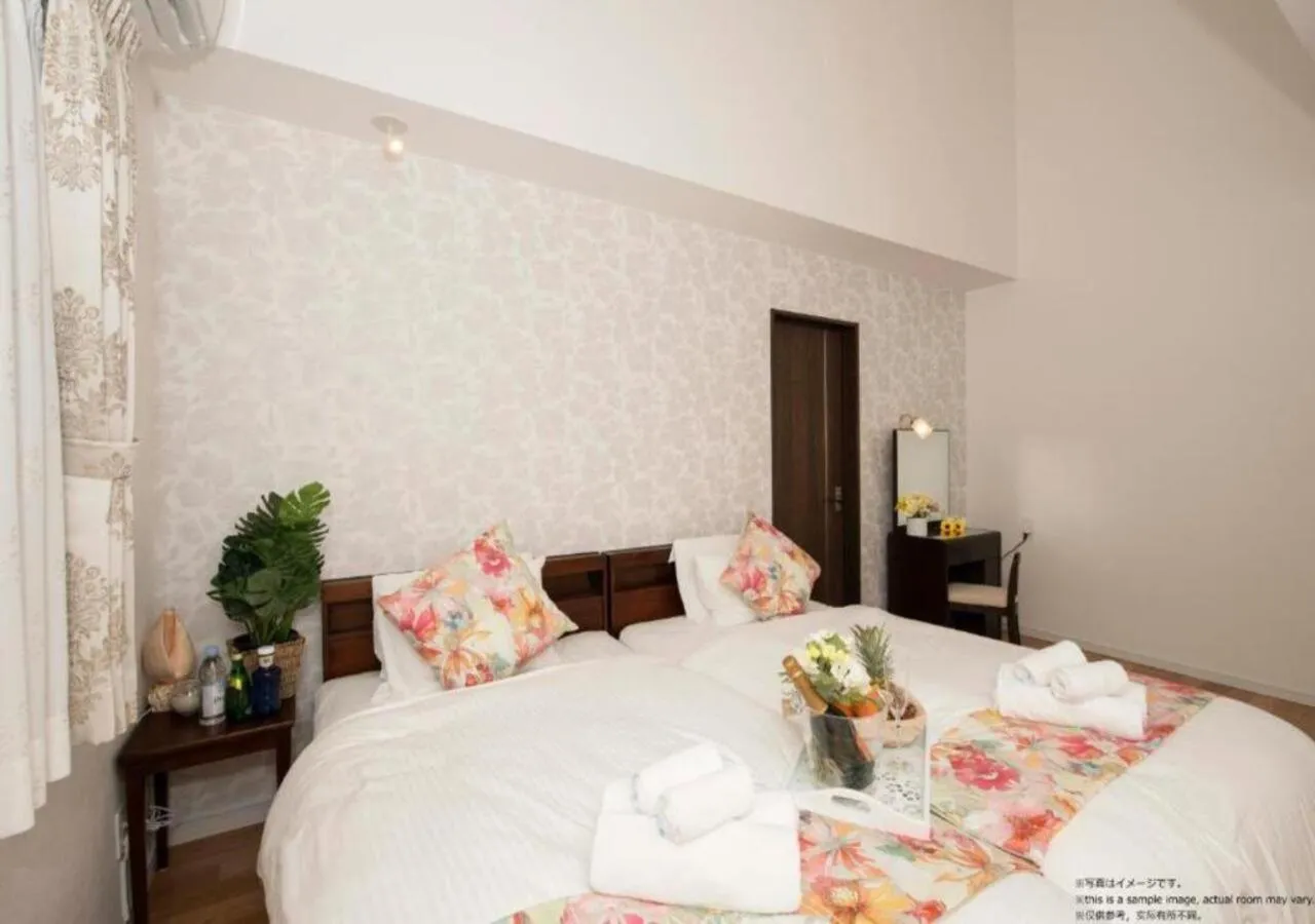 Bed in Miyakojima Villa Charles