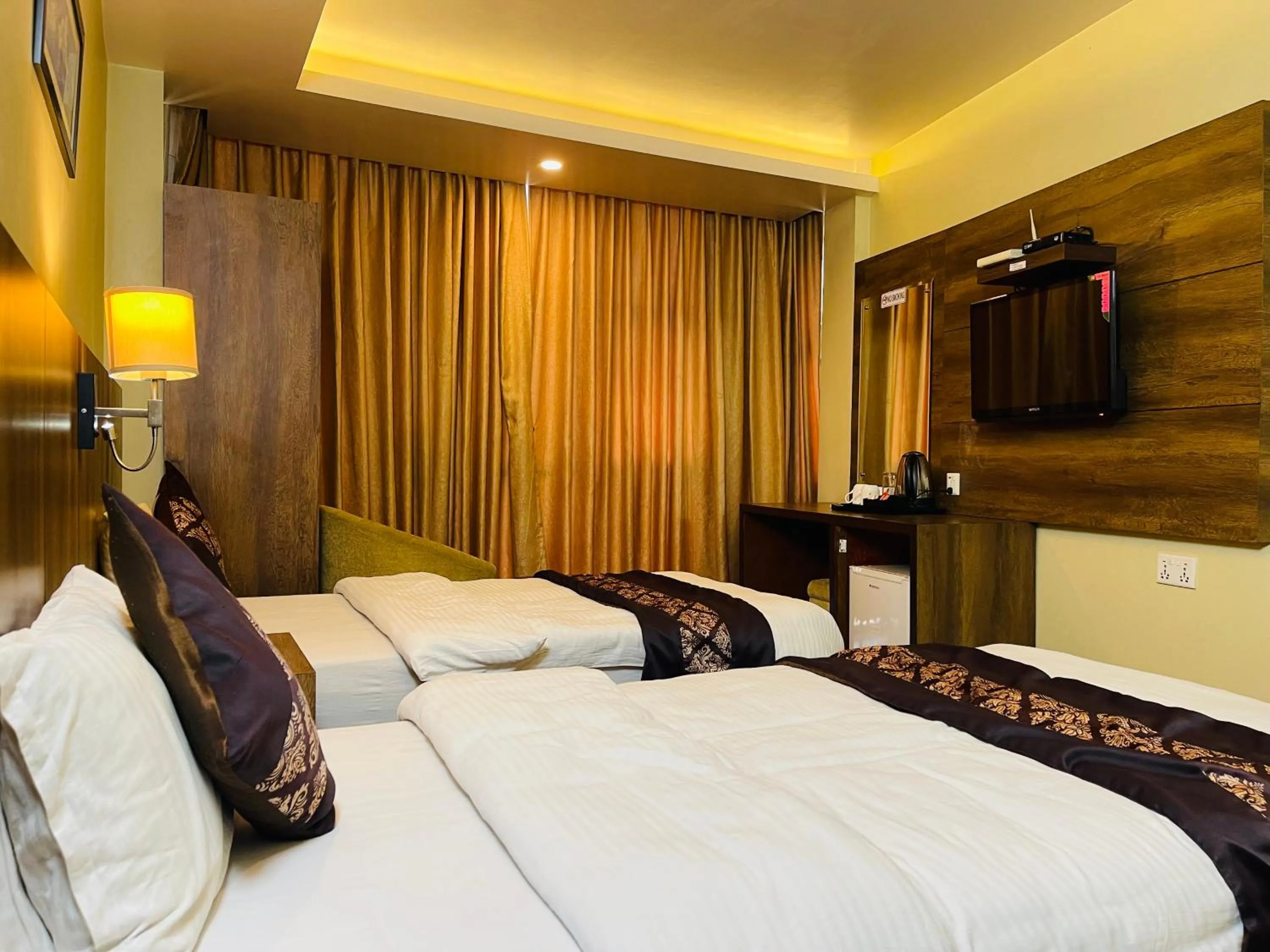 Bed in Ganapati Airport Hotel
